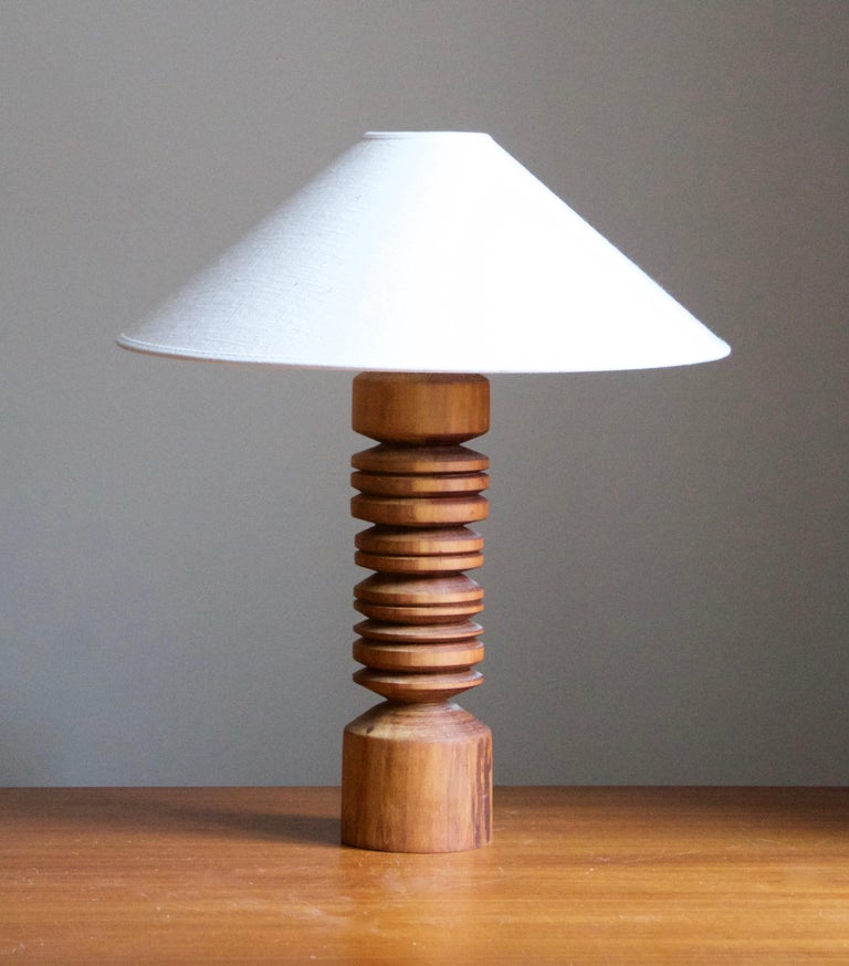 A solid wood table lamp, designed and produced in Sweden, c. 1970s. 

Stated dimensions exclude lampshade. Height includes socket. Sold without lampshade.