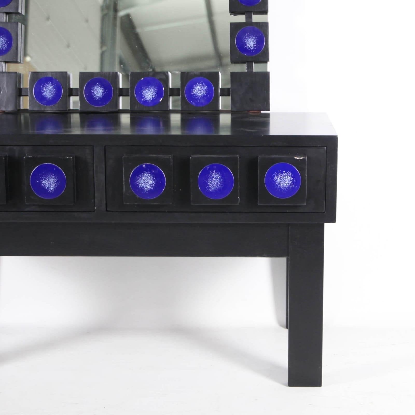 Rare vintage Swedish set of a large mirror and a low 2 drawers console table made of enonized wood and blue painted metal ornaments.
Unusual design, good condition. Very decorative. 
Mirror: 58x120h cm
Console table: 80x40x45h cm
