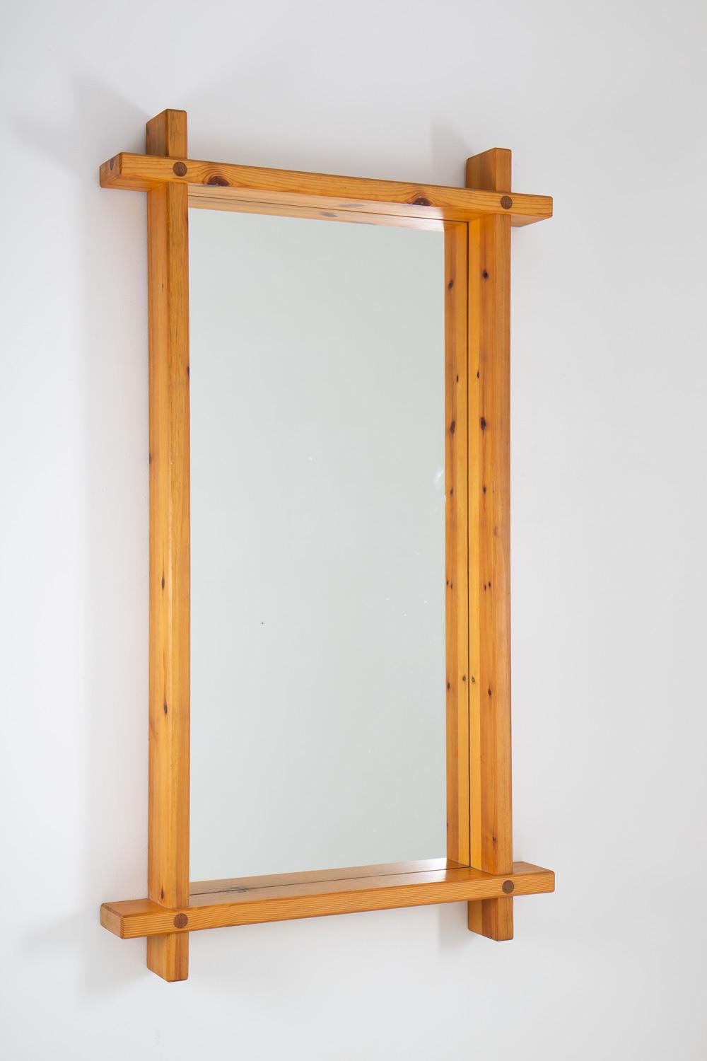 Large rectangular mirror in pine by Eriksmåla, Sweden ca 1970. 
The mirror consists of four thick pine planks, held together with visible joints.

Condition: Very good original condition.