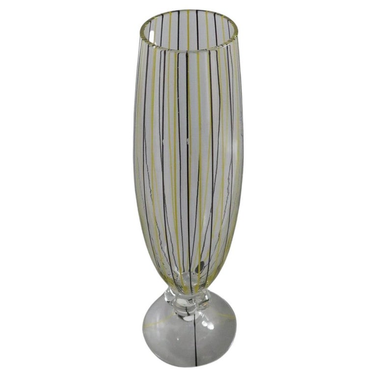 Lovely Swedish blown glass stemmed Vase by AFORS from the 1940s. Hand decorated with perpendicular stripes in alternating black and yellow on the slender fluted body separated from the inverted saucer base by a clear flower shaped stem. One