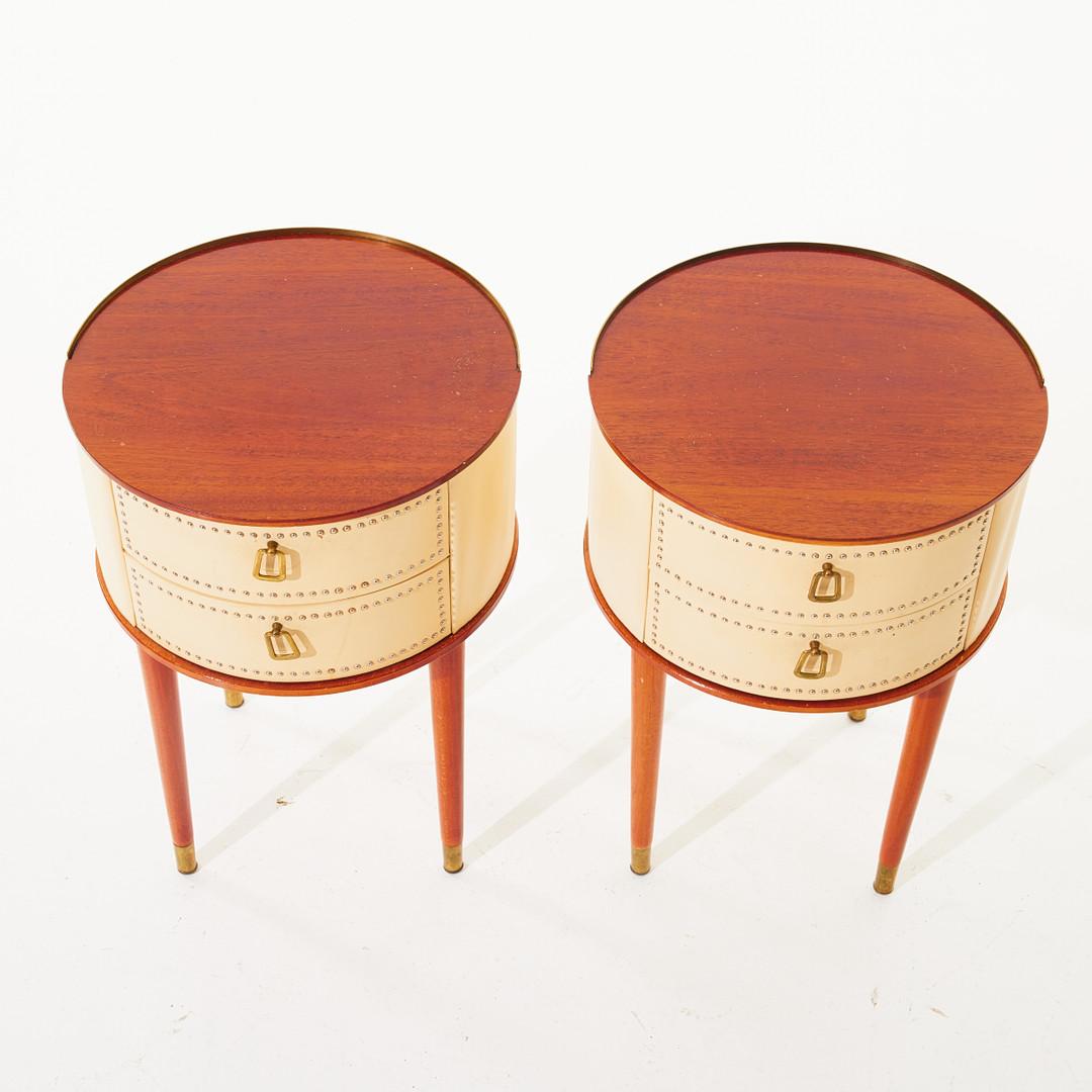 Pair of nightstands made of beech, faux leather and brass rivets and accents designed by Halvdan Pettersson. Produced by Tibro möbelfabrik in Sweden. 