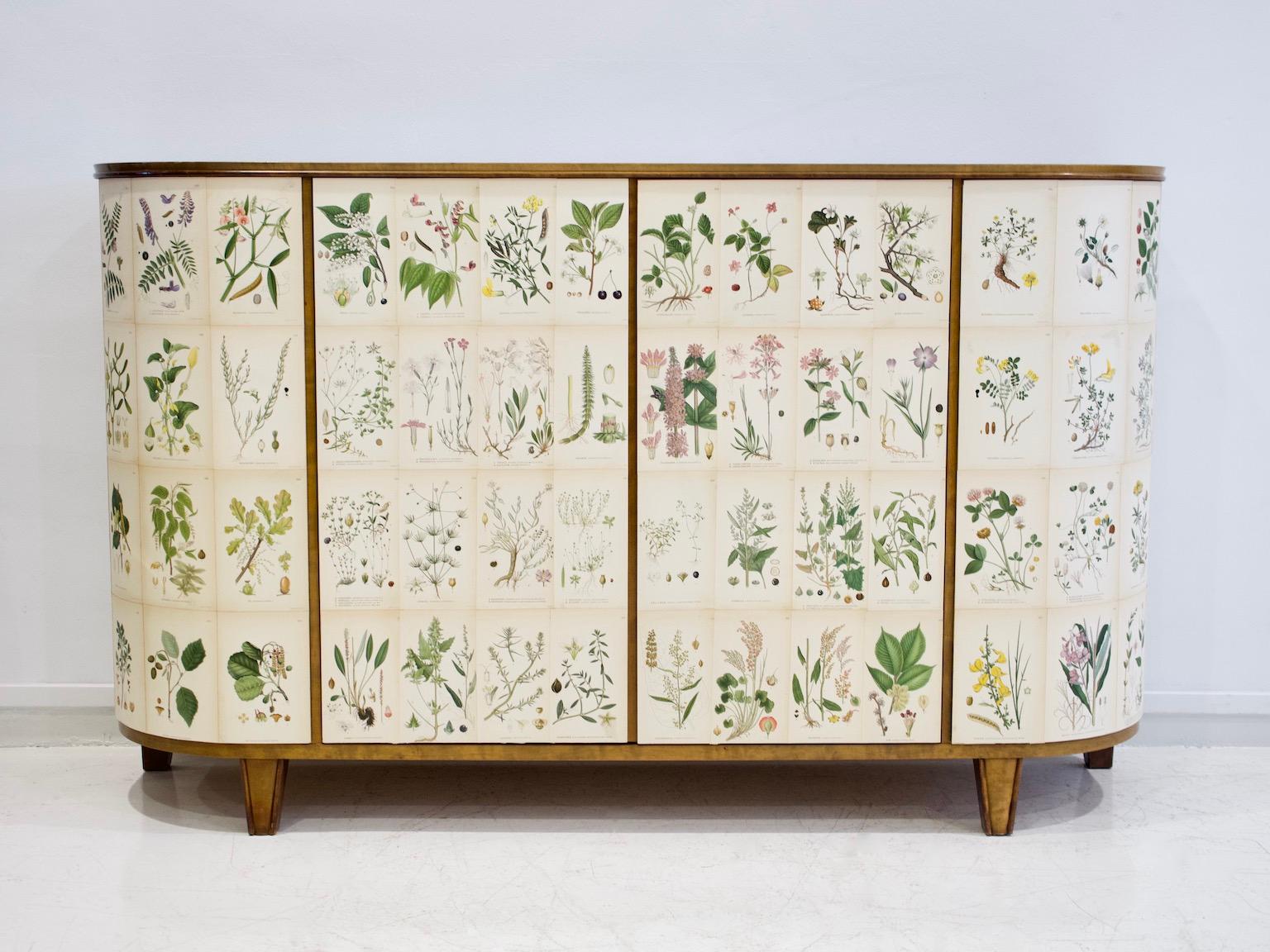 Swedish birch cabinet from the 1940s, later decorated with printed paper. The flower illustrations are from the book 