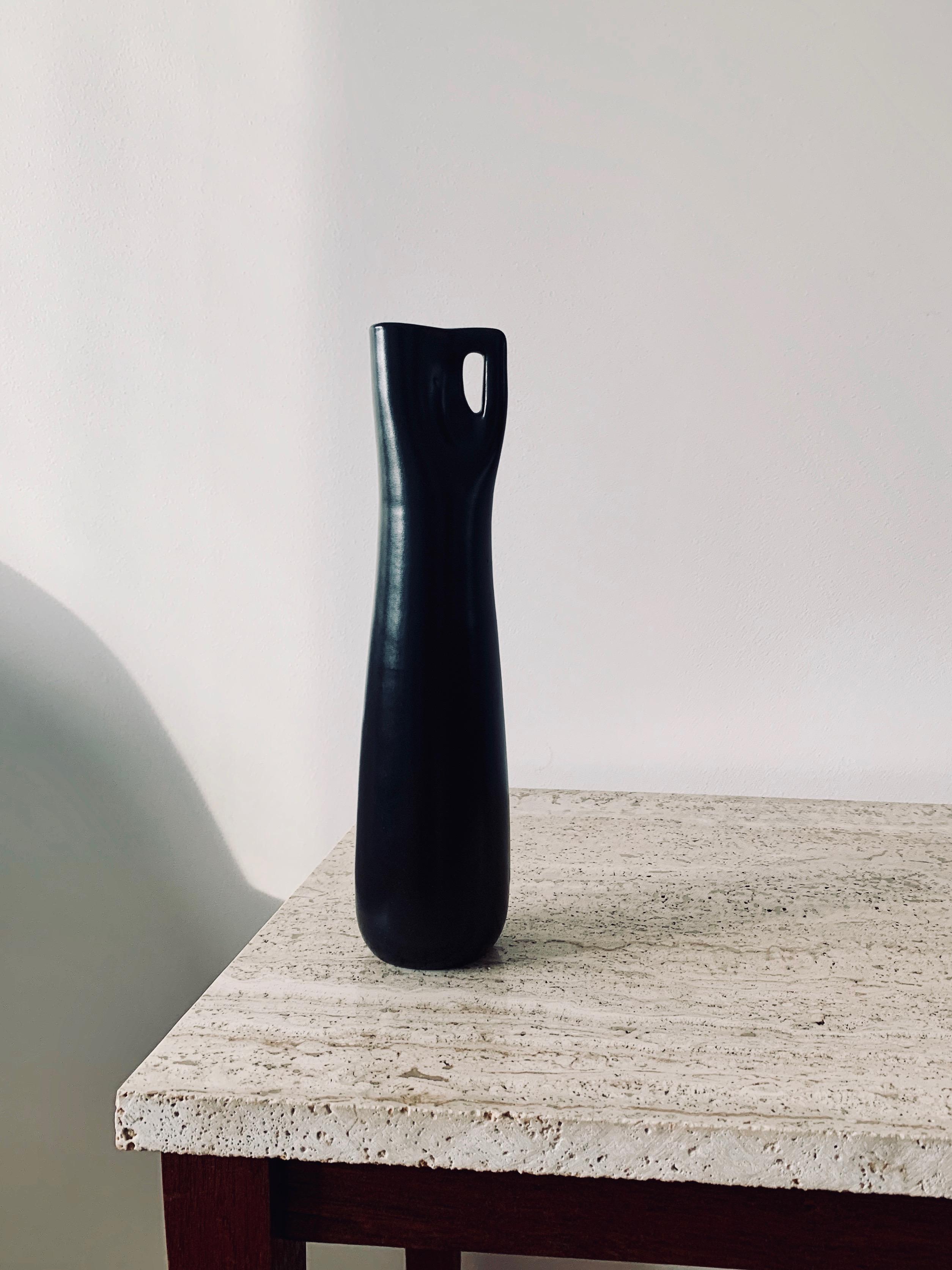 Ingrid Atterberg designed the Somali series for Upsala Ekeby in 1953. It consists of six objects with elegant shapes and silk matte, black glaze. This is model 2142, the second tallest vase in the series.

Measures: Height: 26.5 cm

Diameter: 7