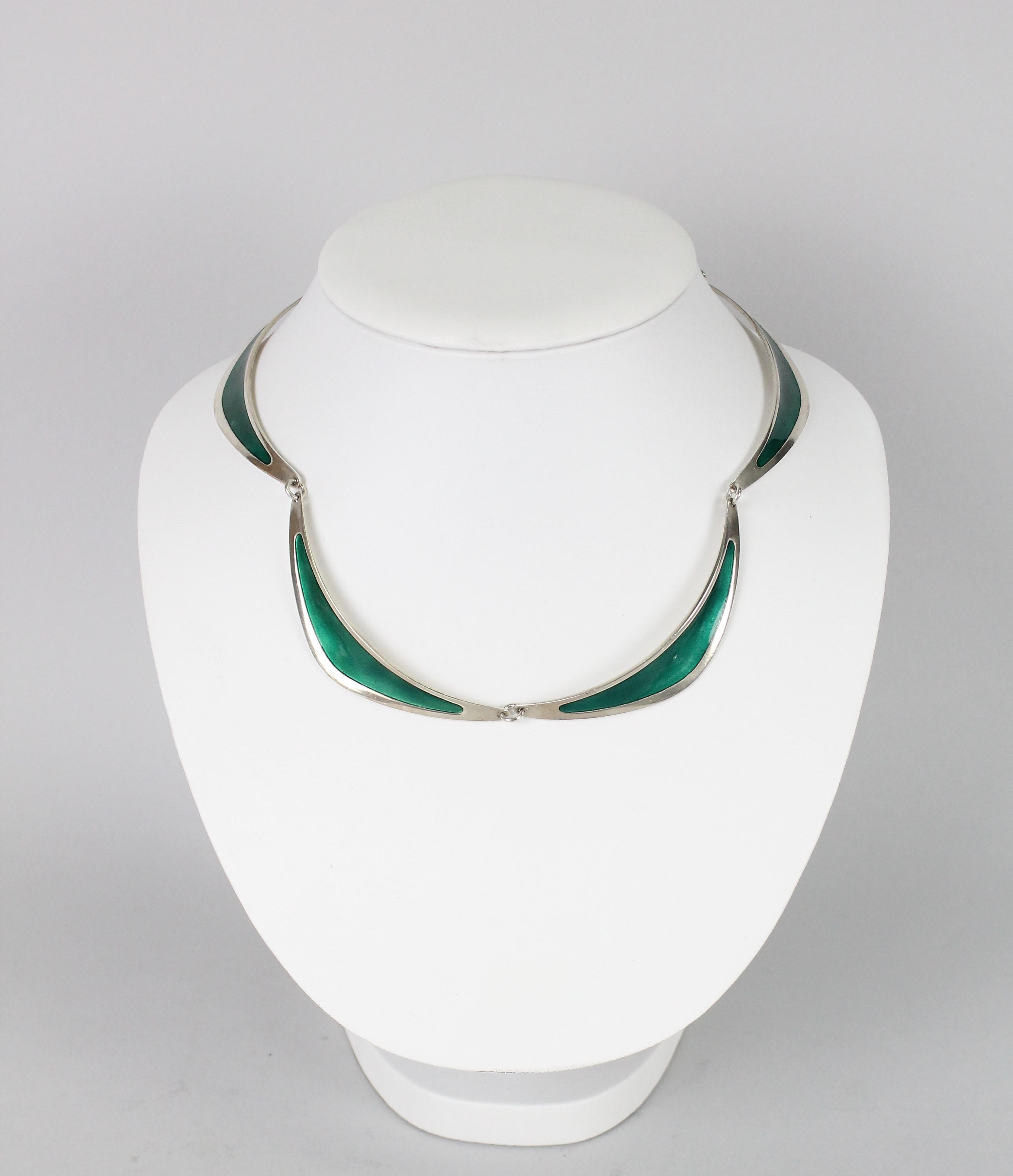 Very nice necklace in sterling silver and green enamel.
Made in Stockholm, Sweden 1958 by Atelier Borgila.
Very nice vintage condition. No issues! 

Atelier Borgila was founded by designer Erik Fleming (1894-1954) in the early 1920s.
In 1933 Borgila