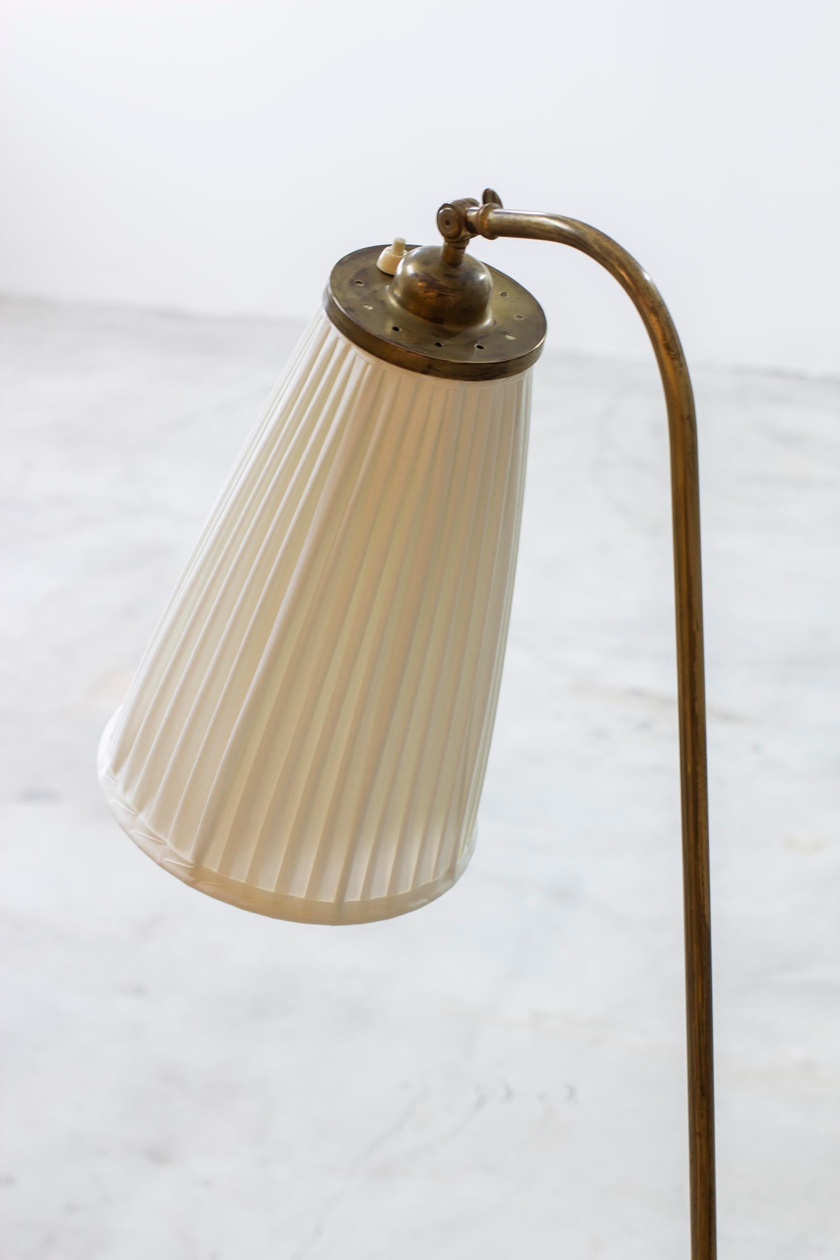 Mid-20th Century Swedish modern brass and fabric floor lamp from the 1940s
