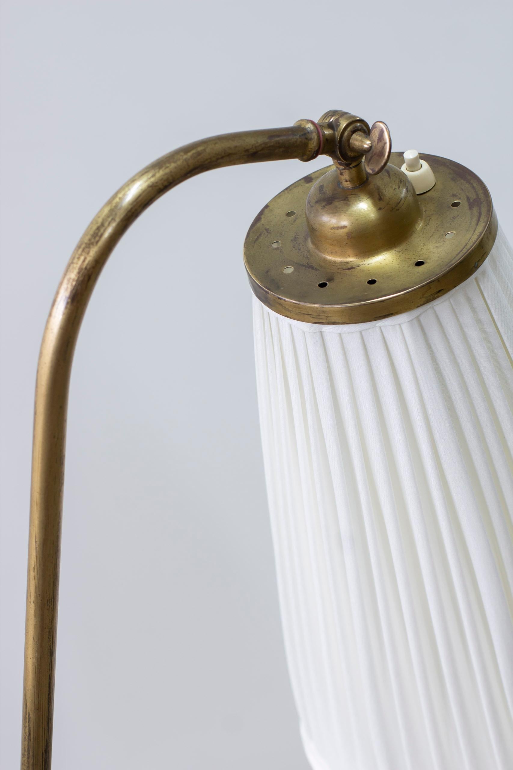 Brass Swedish modern brass and fabric floor lamp from the 1940s