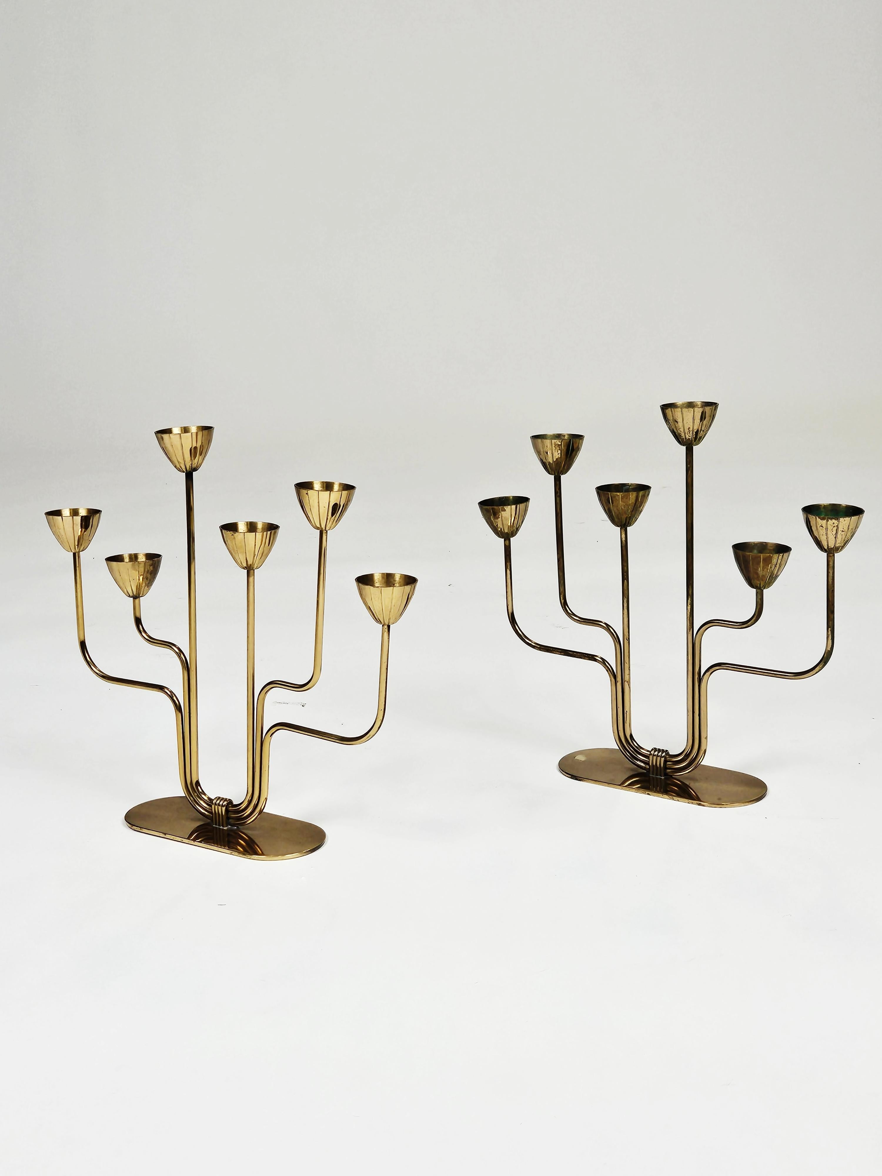 Set of candelabras designed by Gunnar Ander for Ystad Metall in the 1950s. 

Made in brass with six arms. Original condition with patina. 

Marked on bottom. 