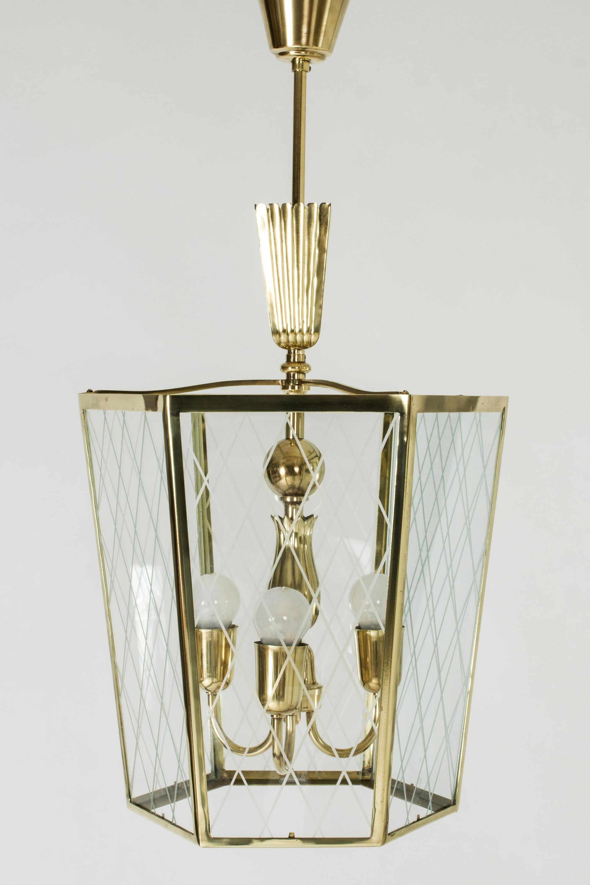 Elegant Swedish Modern ceiling light, made from brass with lovely details. Glass sides with decor of frosted stripes in a diamond pattern.