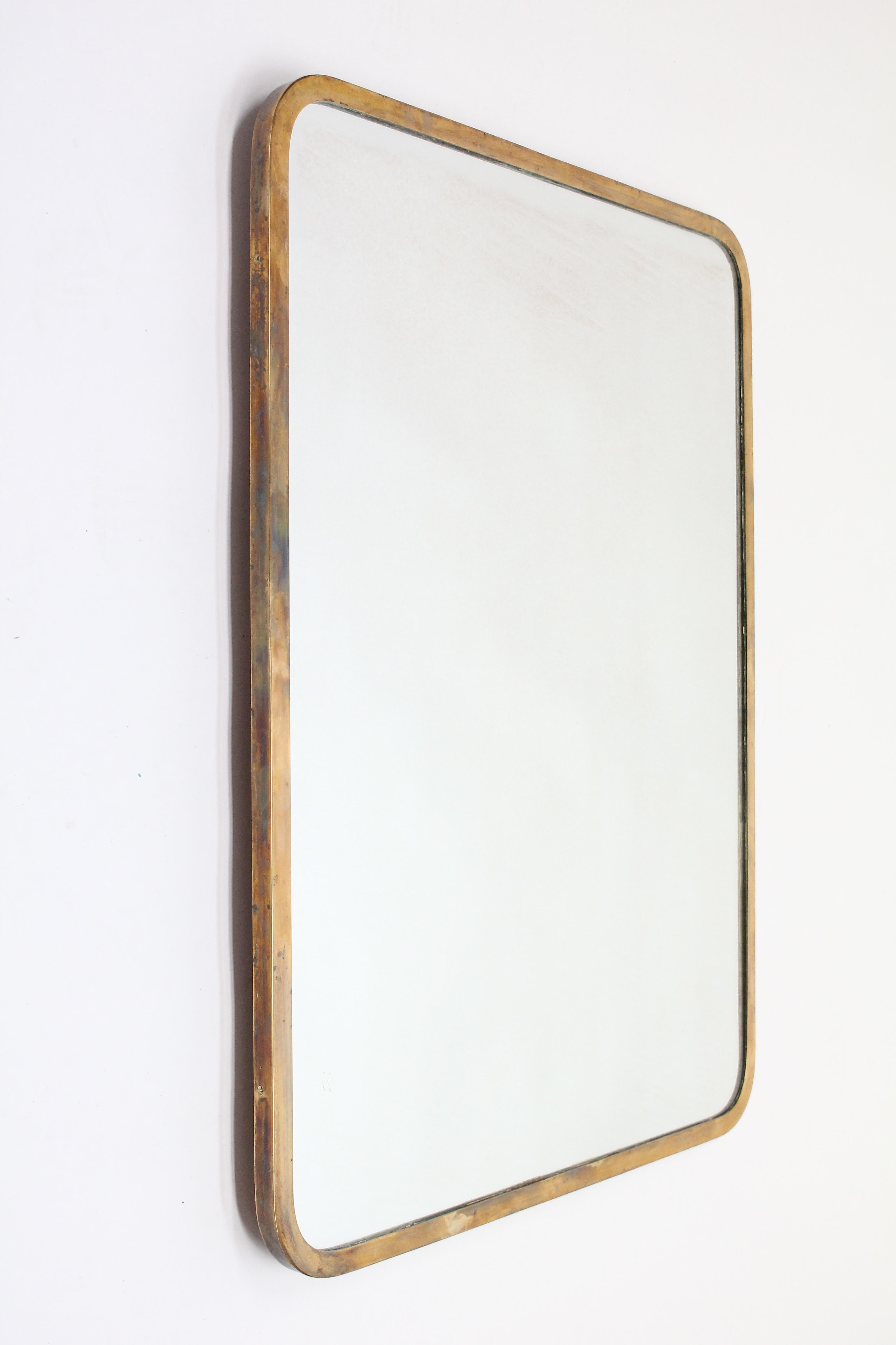 Brass mirror with rounded corners. A very nice example of a 