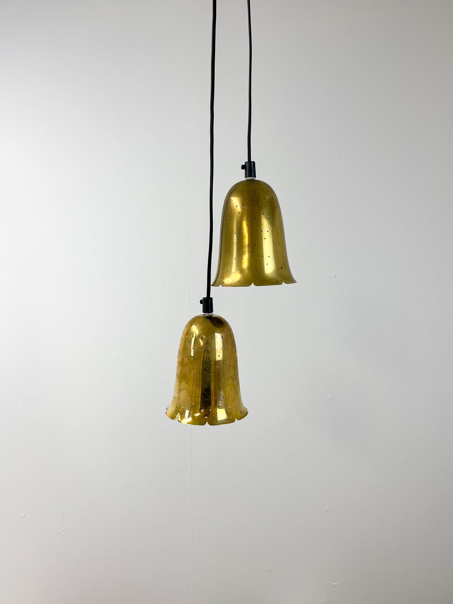 Wonderful set of 2 pendant lamps in brass by Boréns, Sweden.

Condition: Good original condition with a few scratches 
 
Dimesnions: Height: 6.7 in. (17 cm)diameter: 5.12 in. (13 cm).