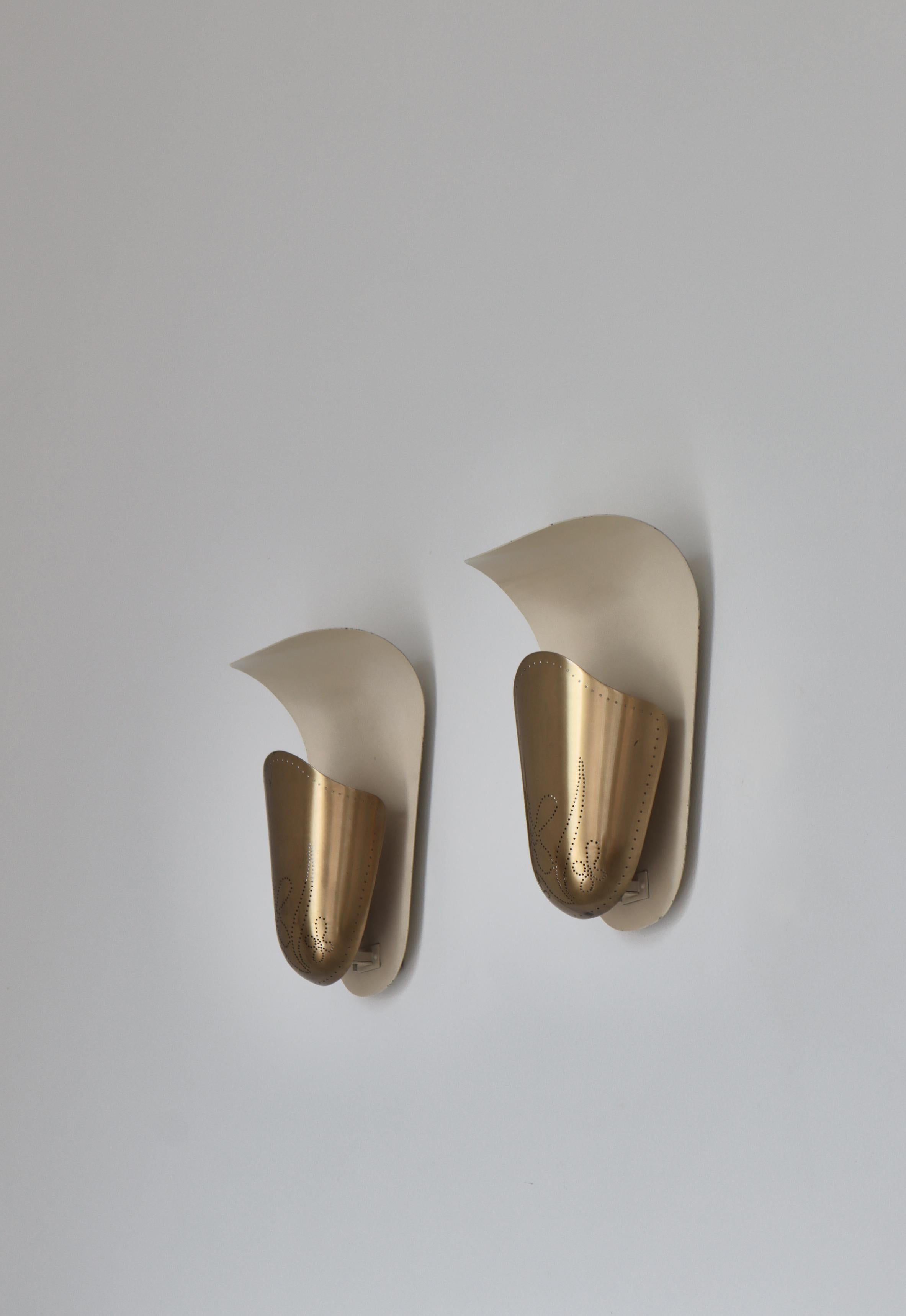 A beautiful pair of Swedish Modern brass wall lamps model 