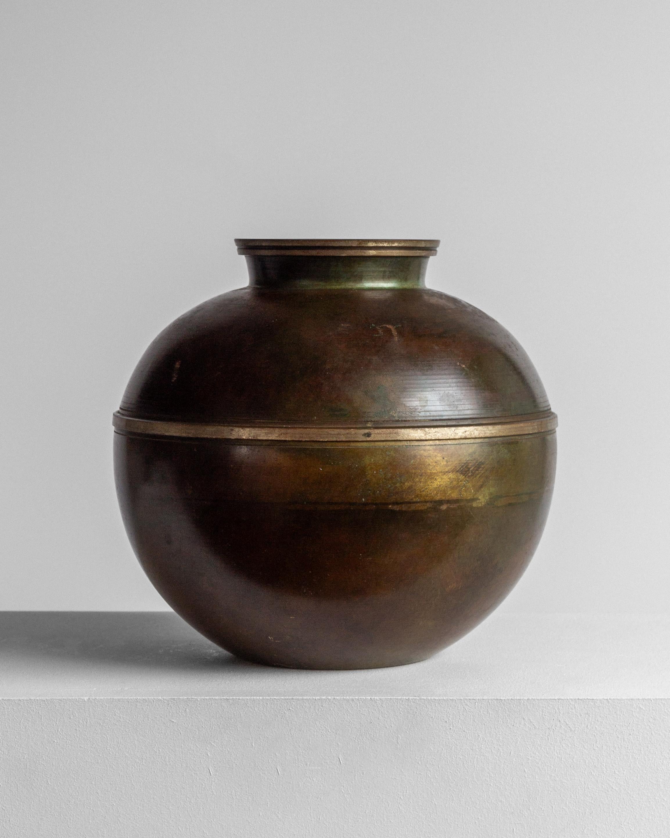 A rare Swedish Modern vase in bronze-patinated metal, crafted by Birka Metall, a subsidiary of GAB (Guldsmedsaktiebolaget), Sweden, circa 1930–1940. This striking spherical vase showcases a beautiful patina with deep, variegated tones of black,
