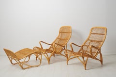 Swedish Modern Bruno Mathsson Pair of Rattan Lounge Chairs and Footstool