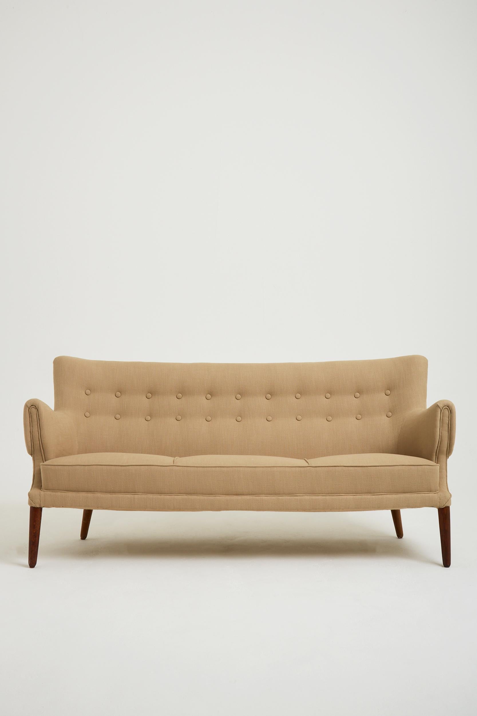 A Mid-Century buttoned sofa.
Sweden, Circa 1940.
Reupholstered in Perennials fabric.