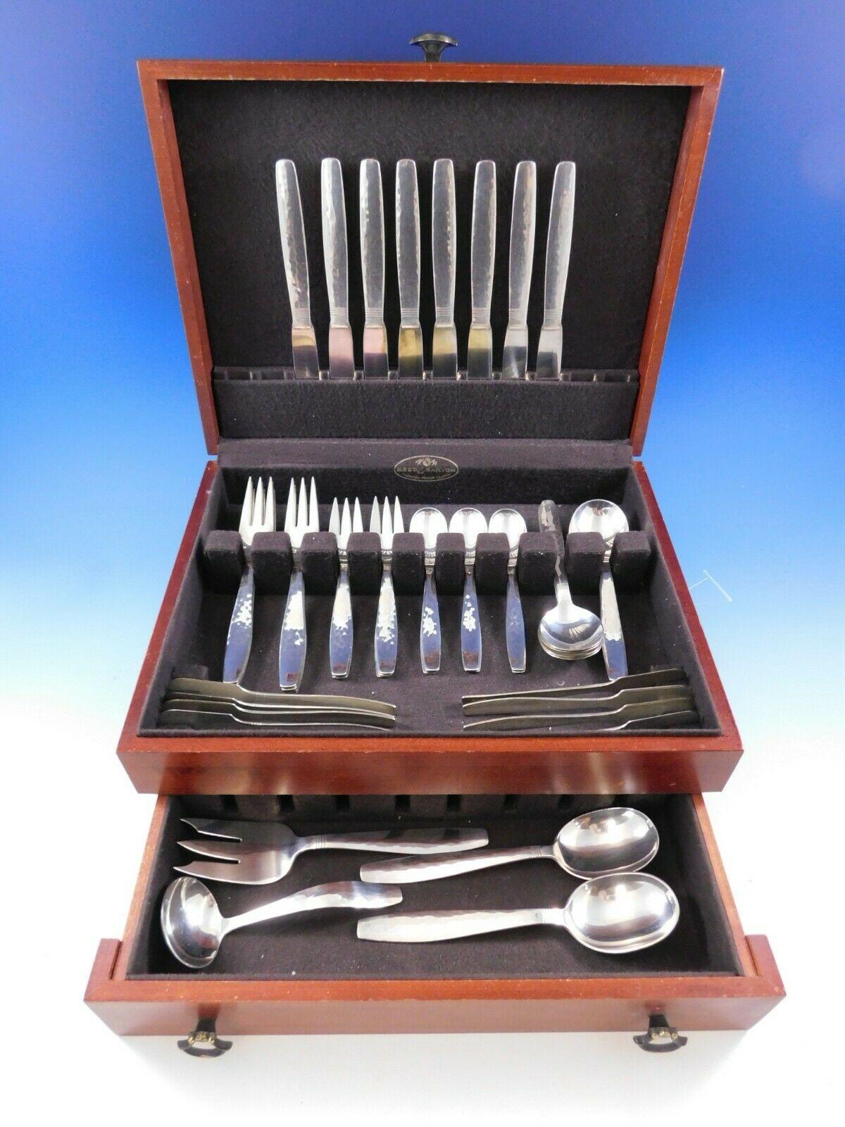 Swedish modern by Allan Adler handwrought sterling silver flatware set with subtle hand-hammered finish, 52 pieces. This set includes:

· 8 dinner knives (solid handles), 8 3/4