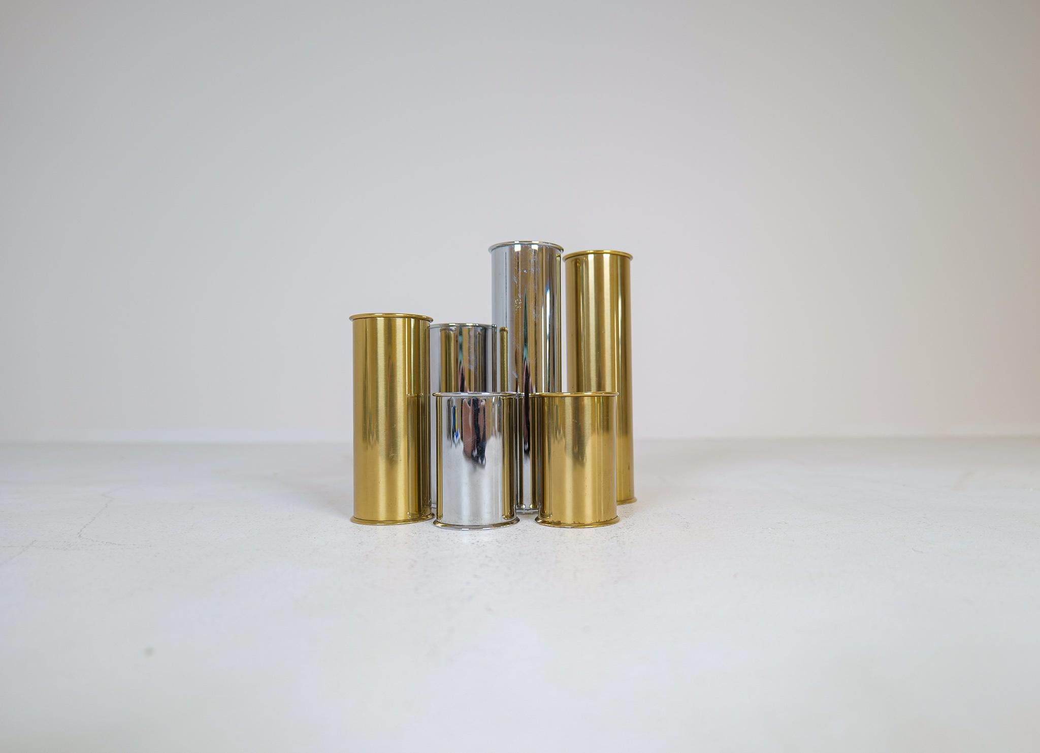 Set of 6 candle holders in brass and worked steel. These icon candleholders was designed by Staffan Englesson in Sweden, 1970s. 
The cylinder-shaped form gives a really nice look and works perfectly with brass and steal to these holders,

Good