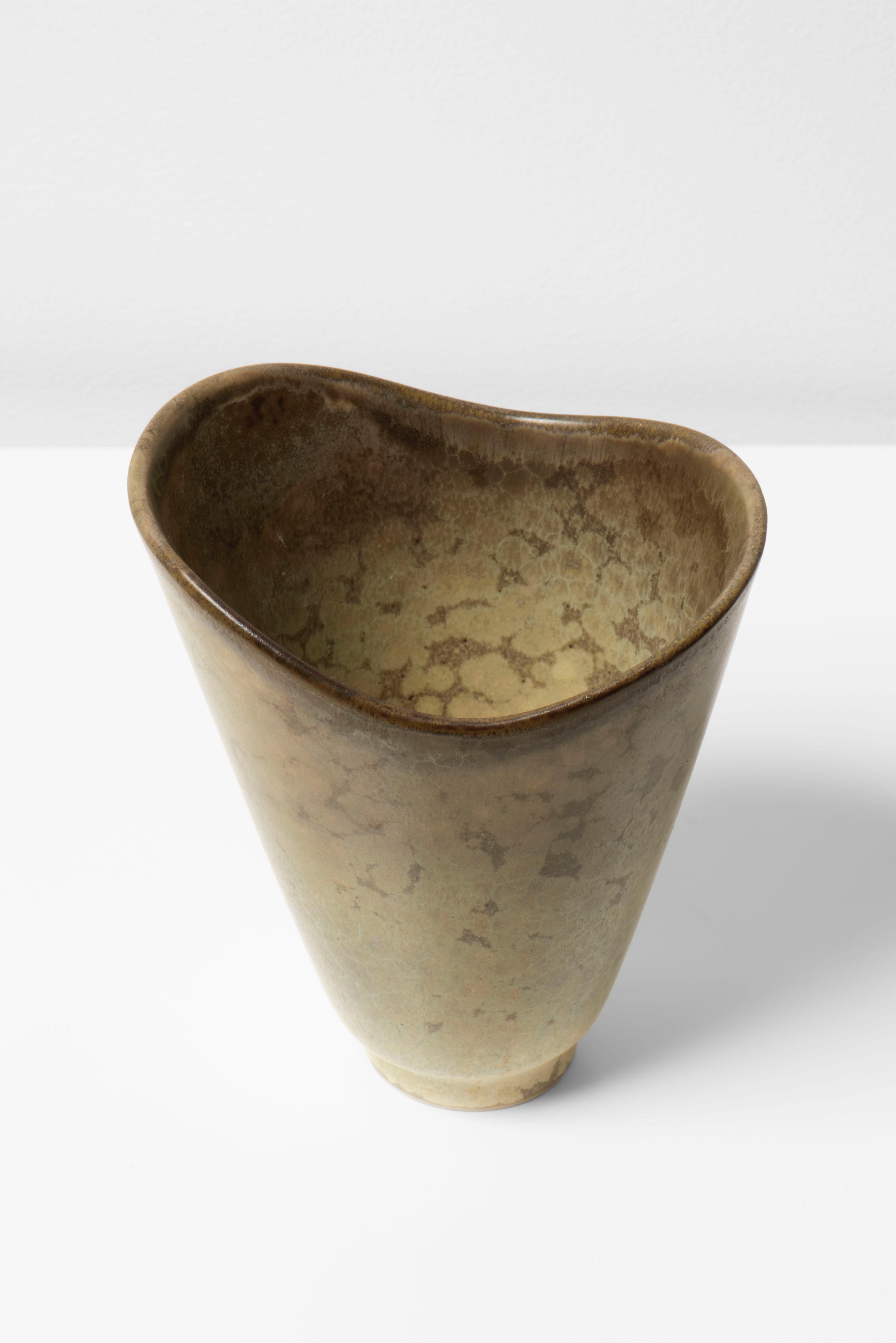 Carl Harry Stålhane was a renowned Swedish ceramicist, born in 1920. He is best known for his remarkable work in the field of ceramics.

Stålhane developed a distinctive style that combined clean, modern shapes with organic glazes and abstract