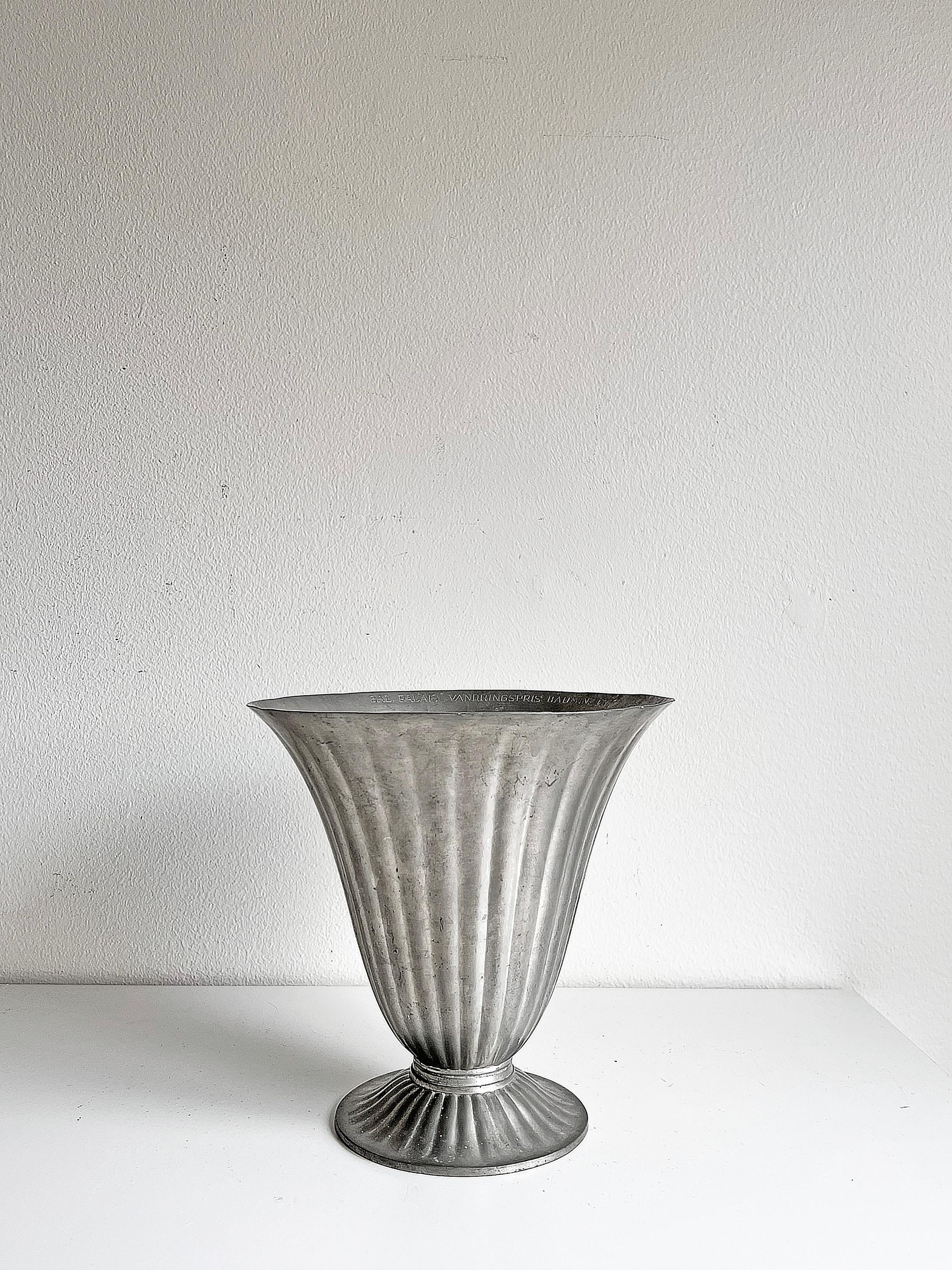 Nice and rare swedish modern cast pewter vase from GVH, Guldvaruhuset Aktiebolag, most probably from ca 1930-1940's. Please notice a discreet inscription inside of the vase, as seen on the last picture. 
Signed with makers mark.

Wear and patina