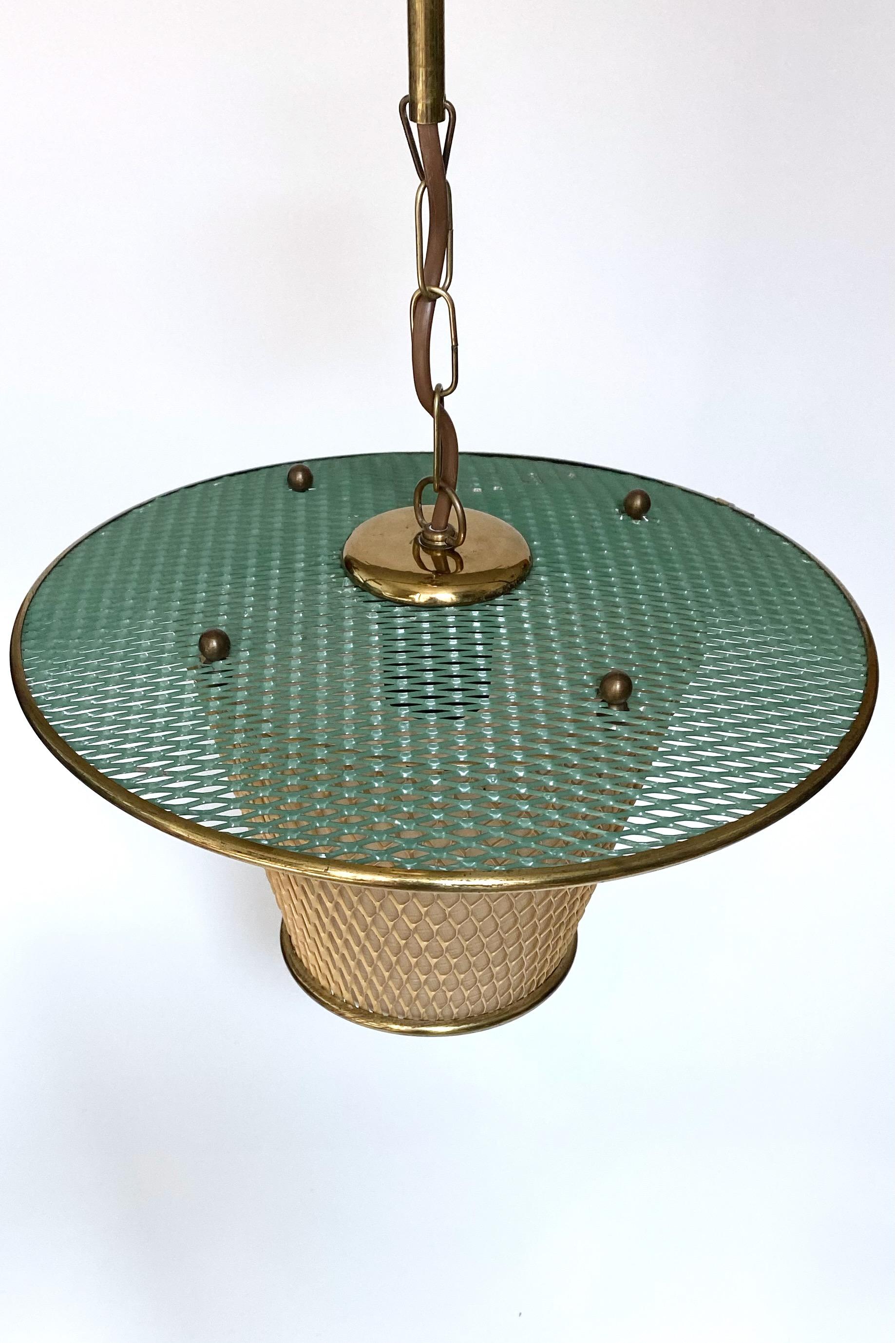 Charming Swedish Modern ceiling lamp from around the 1940/50s. Made out of expanded metal it creates a beautiful mesh design in green and beige colors. Unknown designer and maker. In a very good condition.

Country: Sweden

Year: