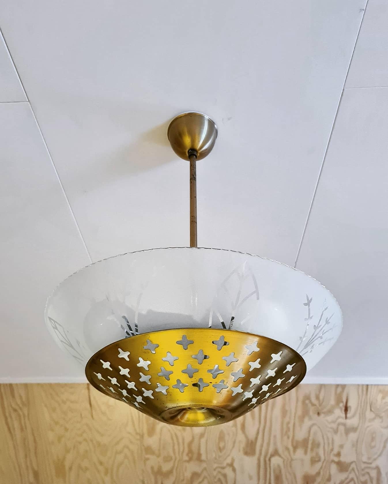 Amazing and rare swedish modern ceiling lamp in brass and glass ca 1950's, in the style of Hans Bergström. Glass with beautiful decor. 

Good vintage condition, wear consistent with age and use. Brass patina. Small chips, most probably from the