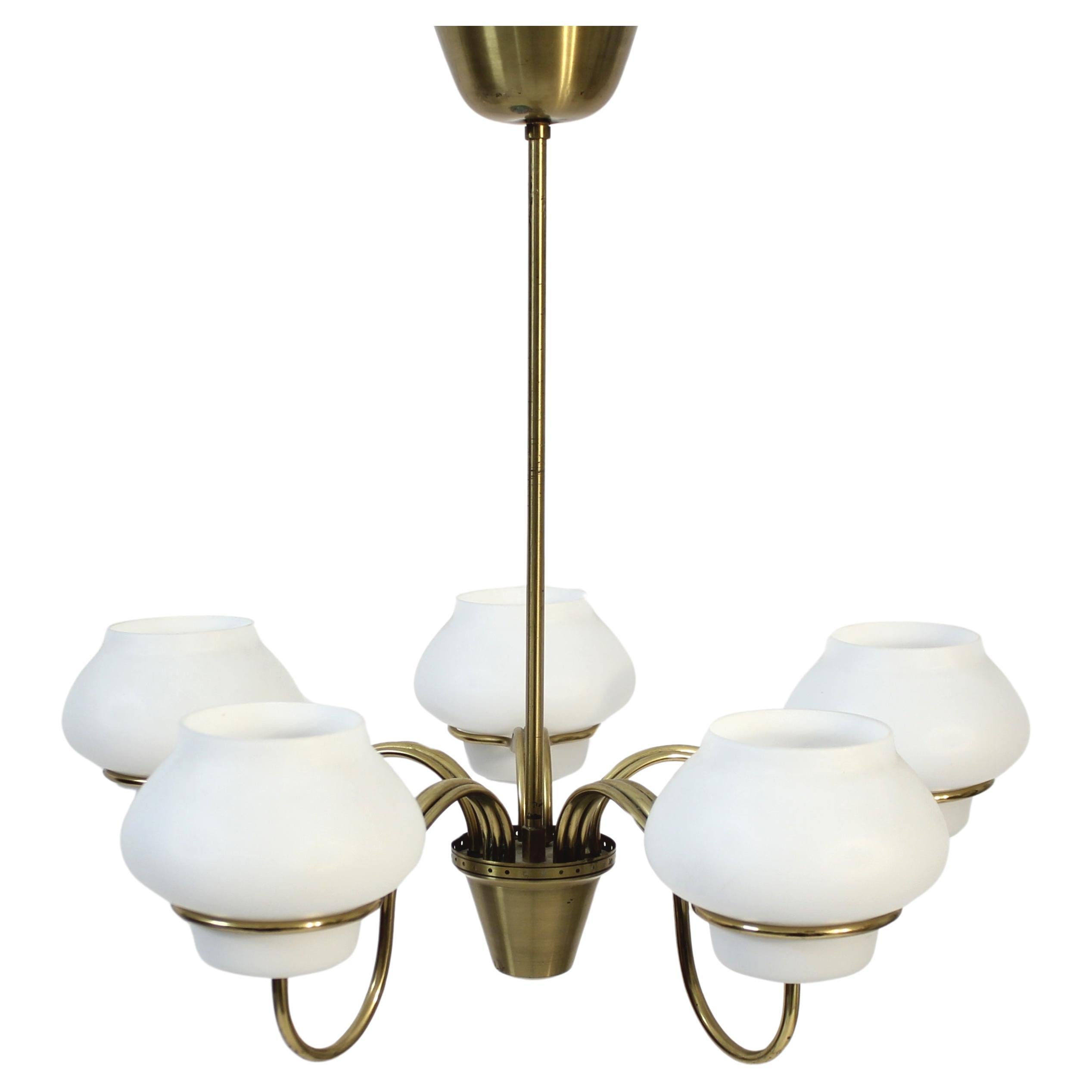5-light ceiling mounted chandelier attributed to Gunnar Asplund for ASEA but unmarked. It has opalin glass shades on a brass frame. The mount of the shades are very much like a few other models designed by Asplund. Very good vintage condition with