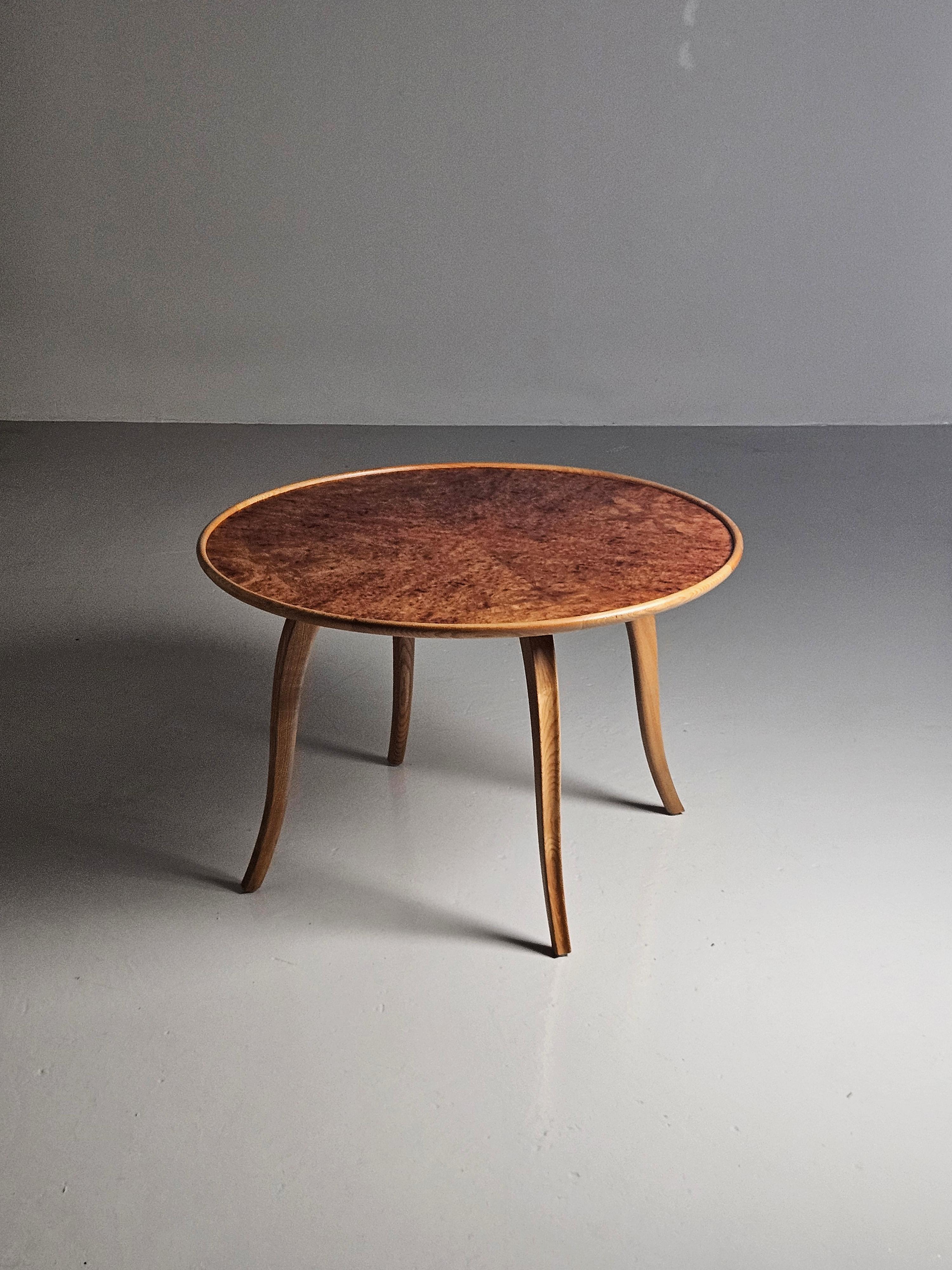 Wonderful coffee table produced by Reiners Möbelfabrik, Mjölby, Sweden, during the 1940s. 

Elm root table top with sculptural legs made out of elm. 
