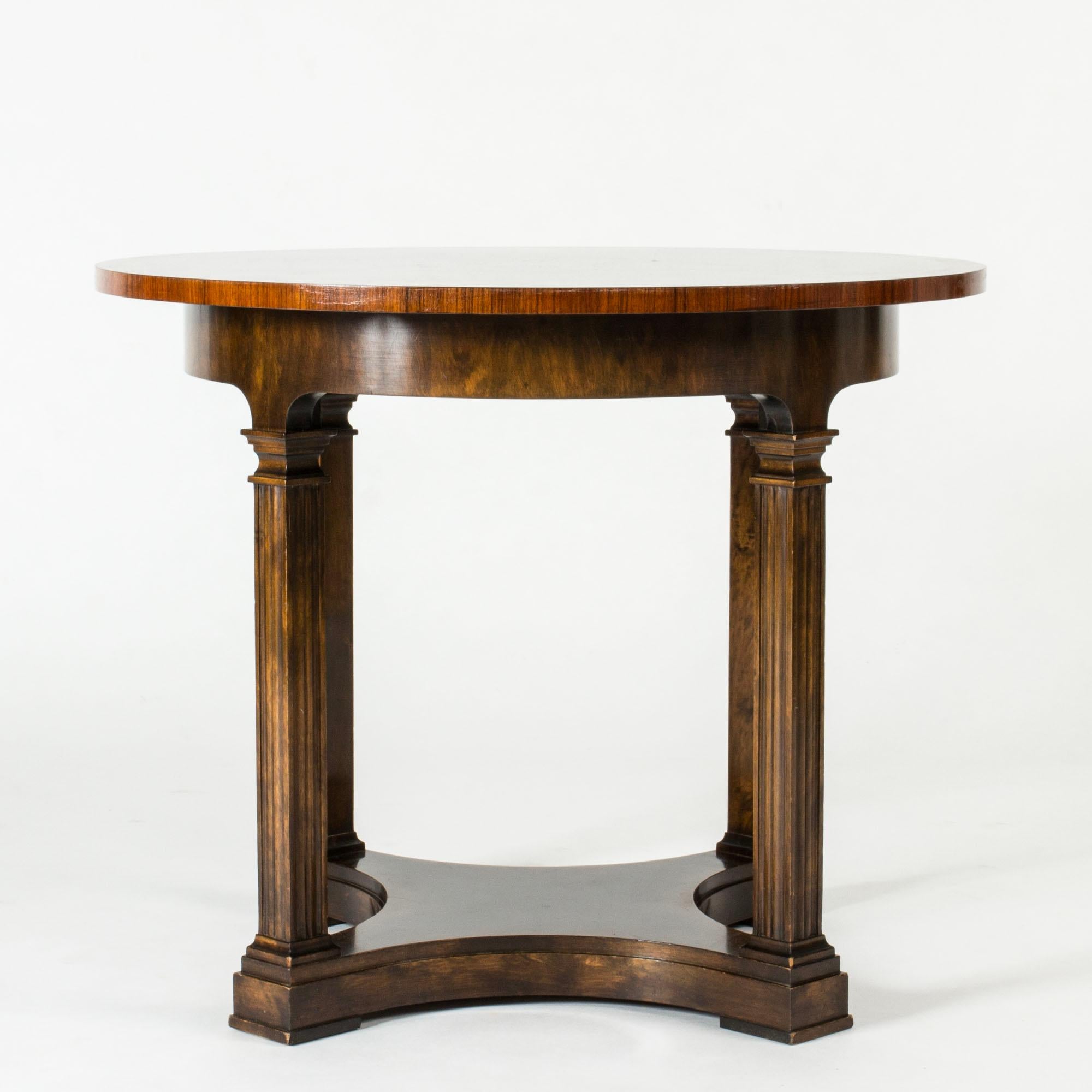 Elegant console table by Axel Einar Hjorth, made from stained wood with a beautiful root table top. Model called “Radio”. Legs with decorative sculpted details.