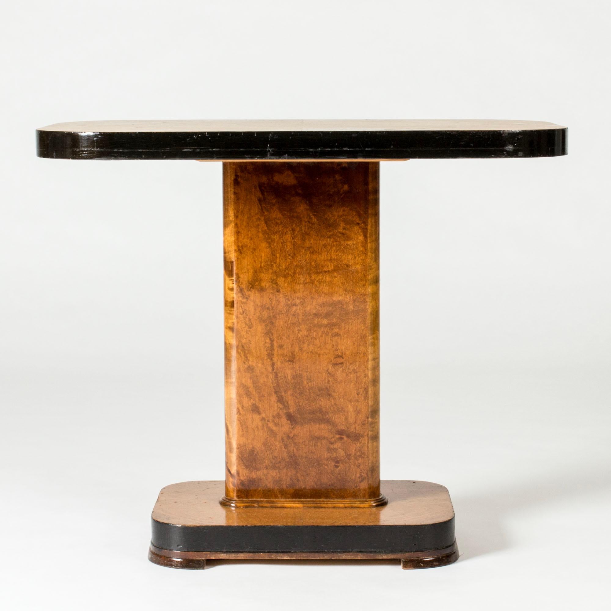 Beautiful Swedish Modern console table, with clean functionalist lines and rounded forms. Made from elm painted contrasting black around the table and base edges.