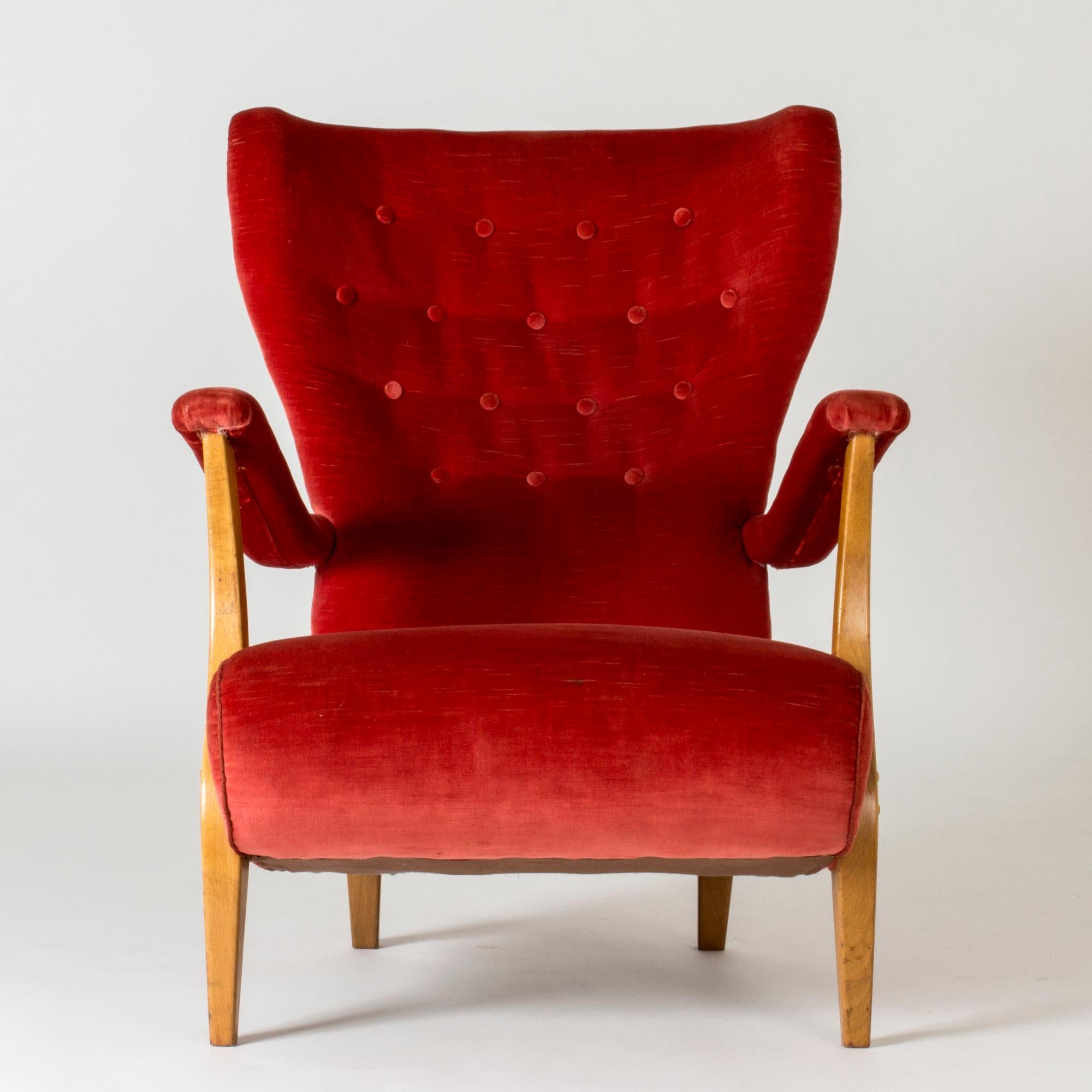 Beautiful Swedish Modern easy chair, with bold flowing lines. Original coral pink velvet upholstery.