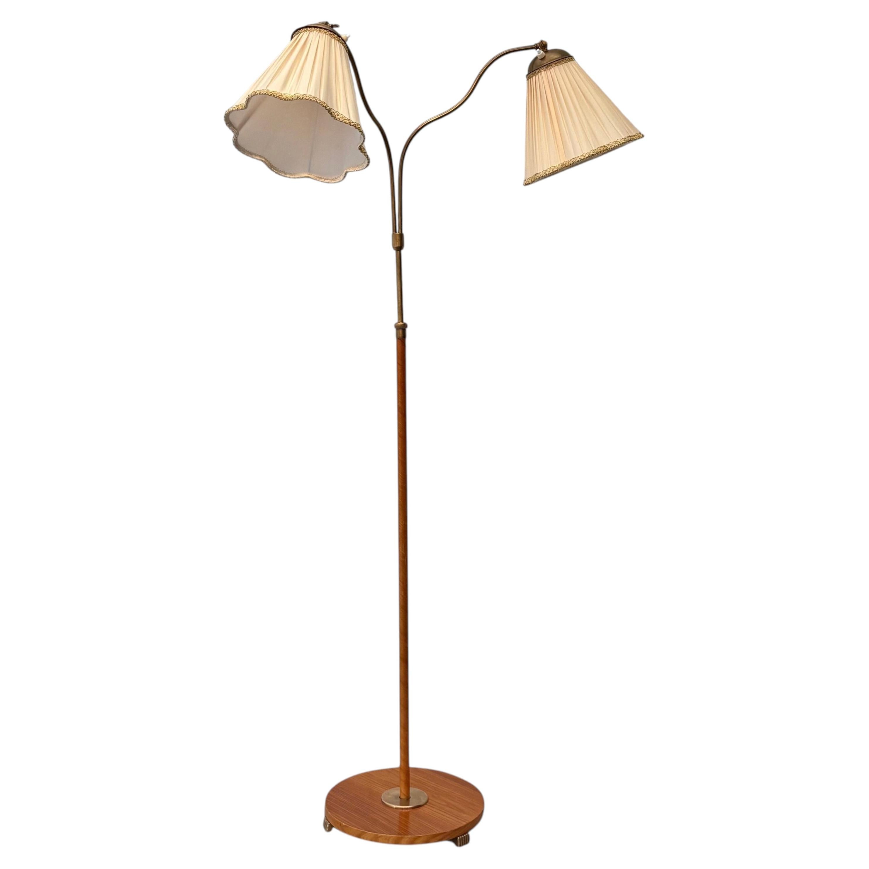 Swedish Modern floor lamp, brass & teak, Sweden, 1930s