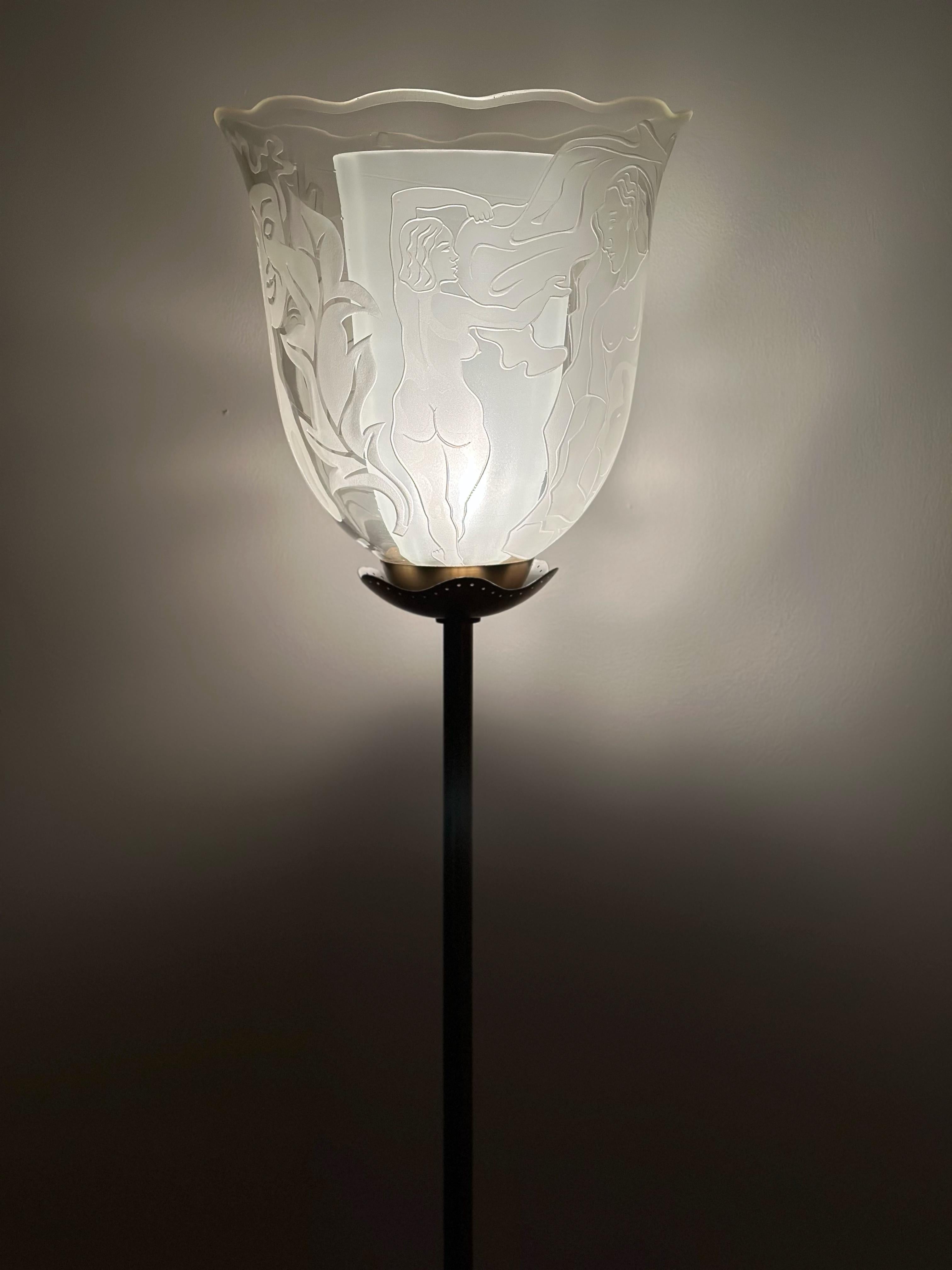 Sleek and very sophisticated floor lamp by Bo Notini for Glössner, designed and crafted during the 1940s. This impressive floor lamp features one light source hidden by two large glass shades, held in place by a beautiful perforated brass