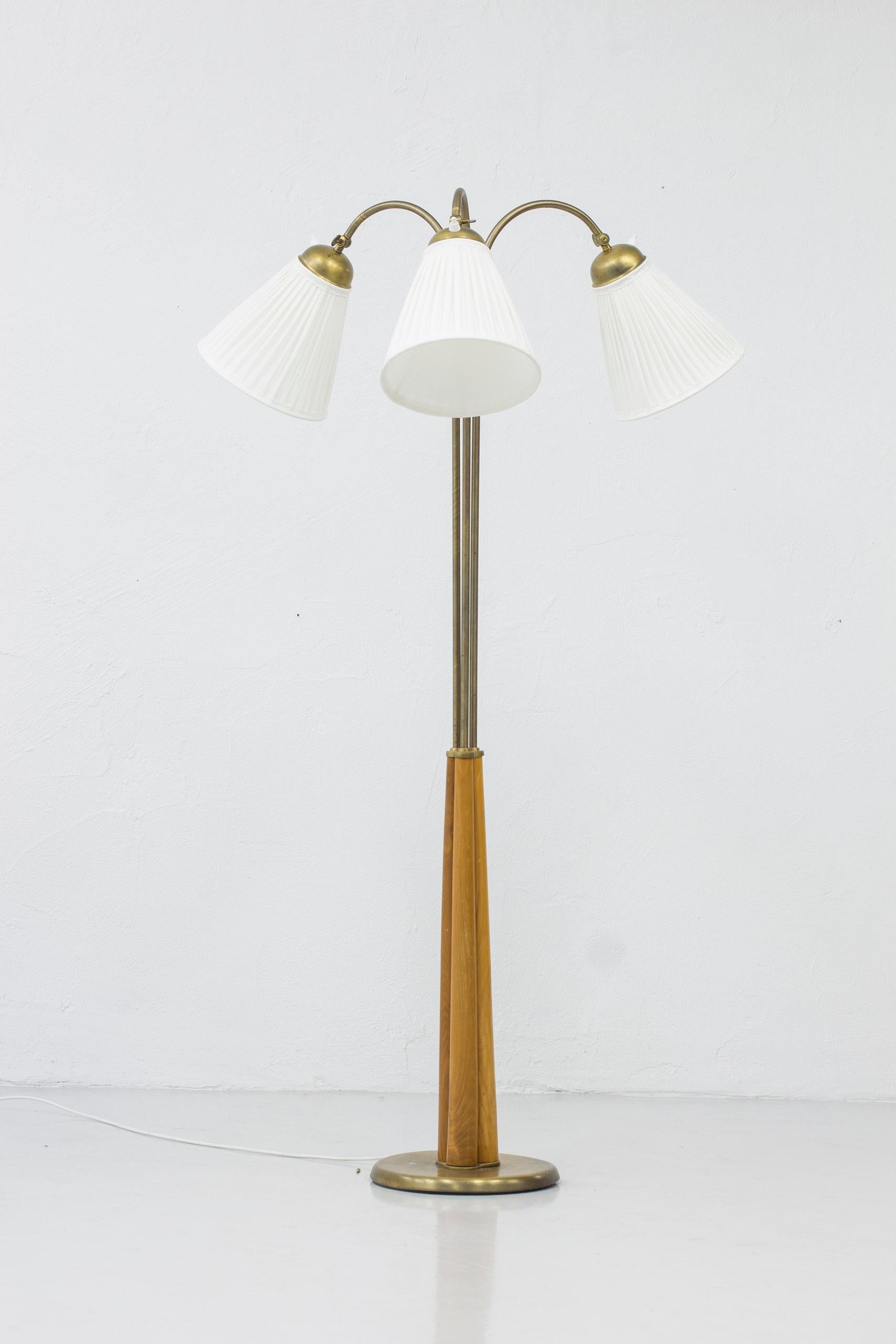 Scandinavian Modern Swedish modern floor lamp elm and brass with three arms, Sweden, 1940s