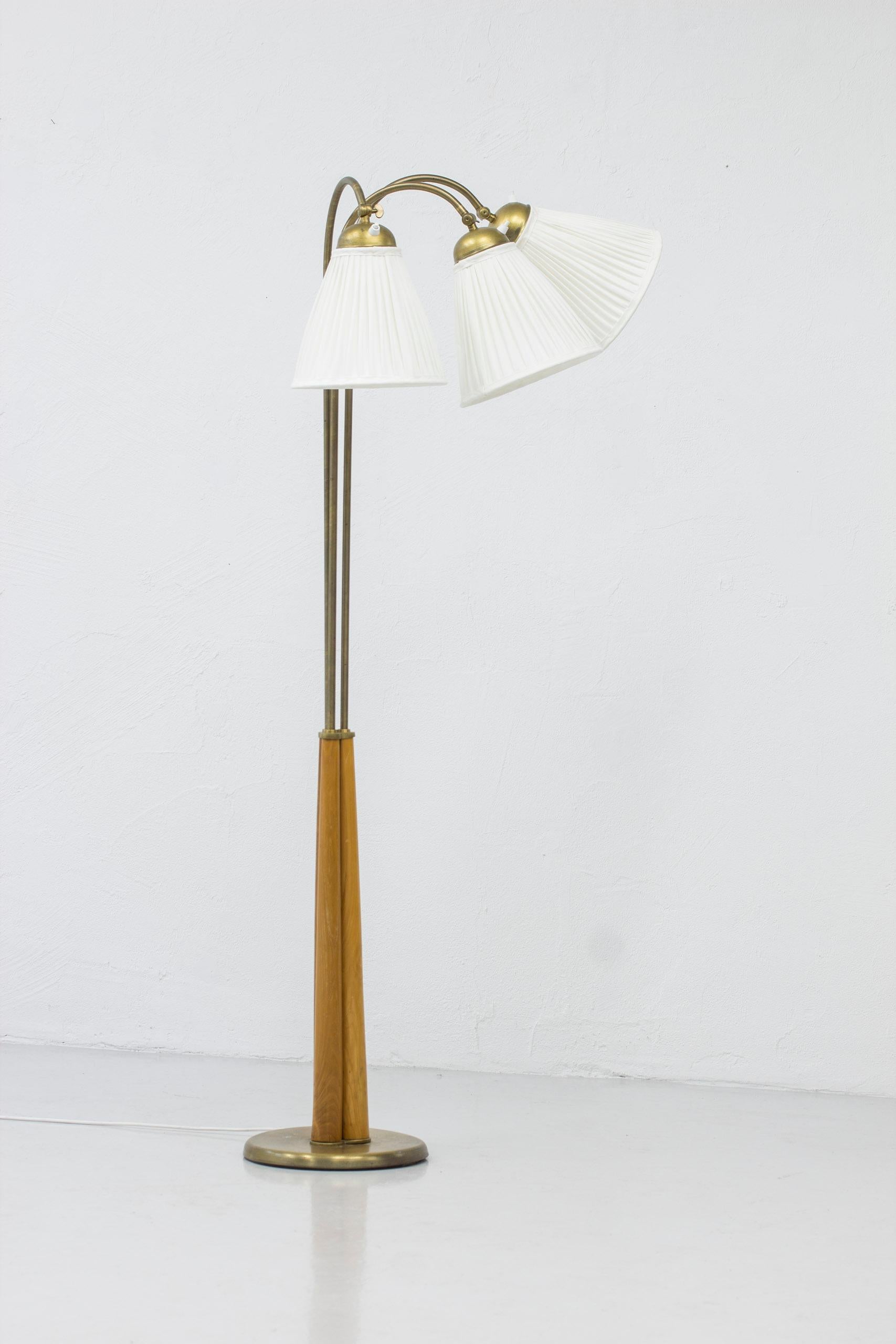 Mid-20th Century Swedish modern floor lamp elm and brass with three arms, Sweden, 1940s