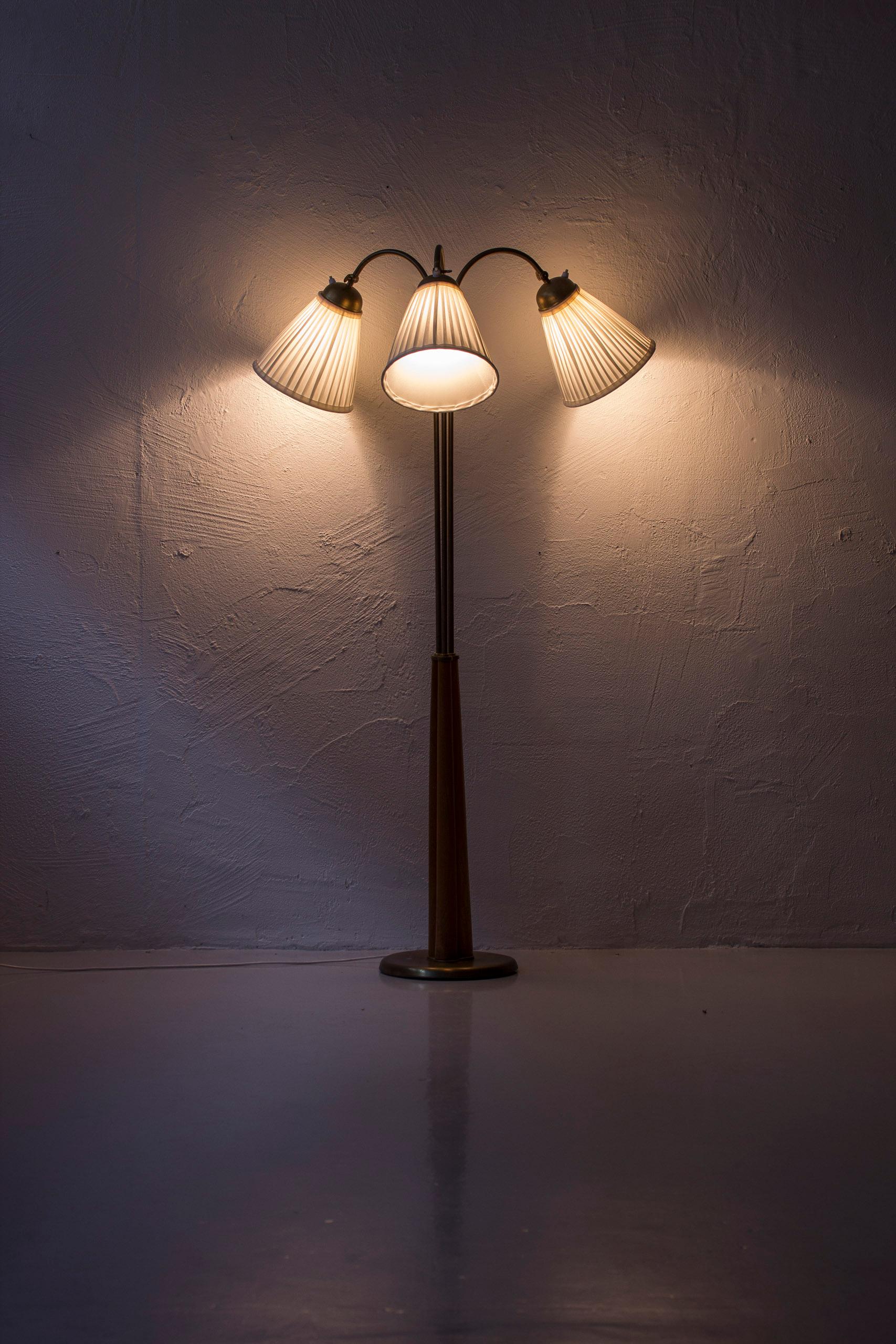 Brass Swedish modern floor lamp elm and brass with three arms, Sweden, 1940s