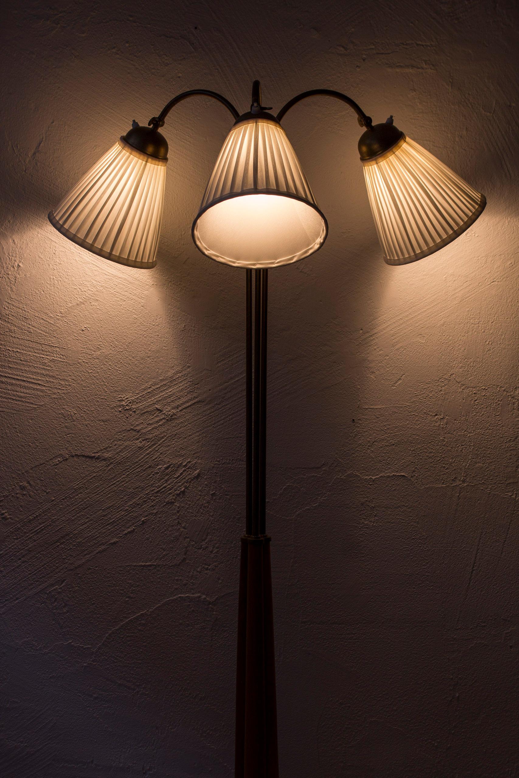 Swedish modern floor lamp elm and brass with three arms, Sweden, 1940s 1