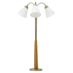 Swedish modern floor lamp elm and brass with three arms, Sweden, 1940s