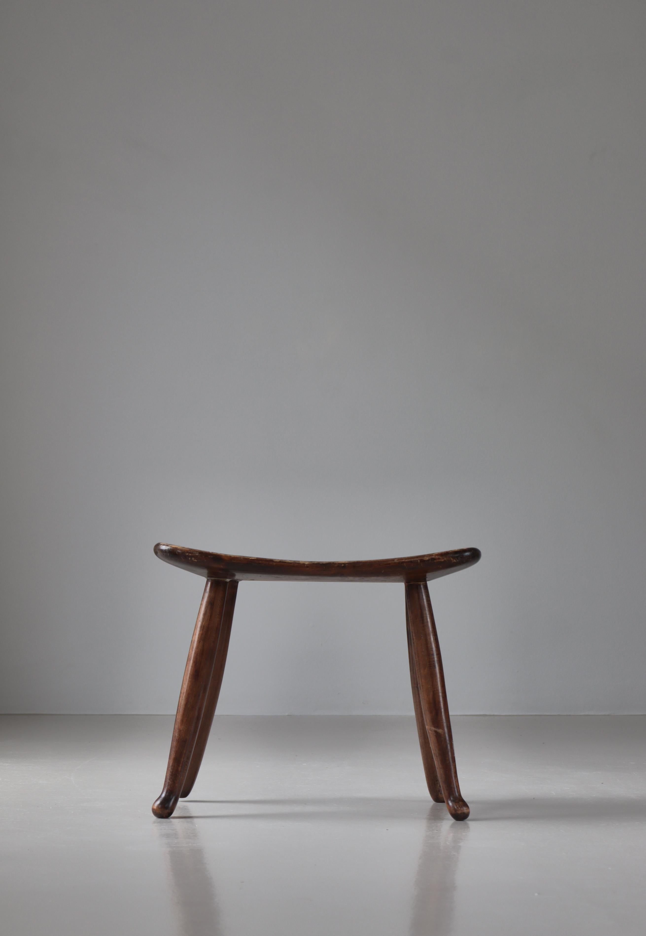 Wonderful handmade stool in stained beech made in the 1930s Sweden. In the style of Josef Frank.