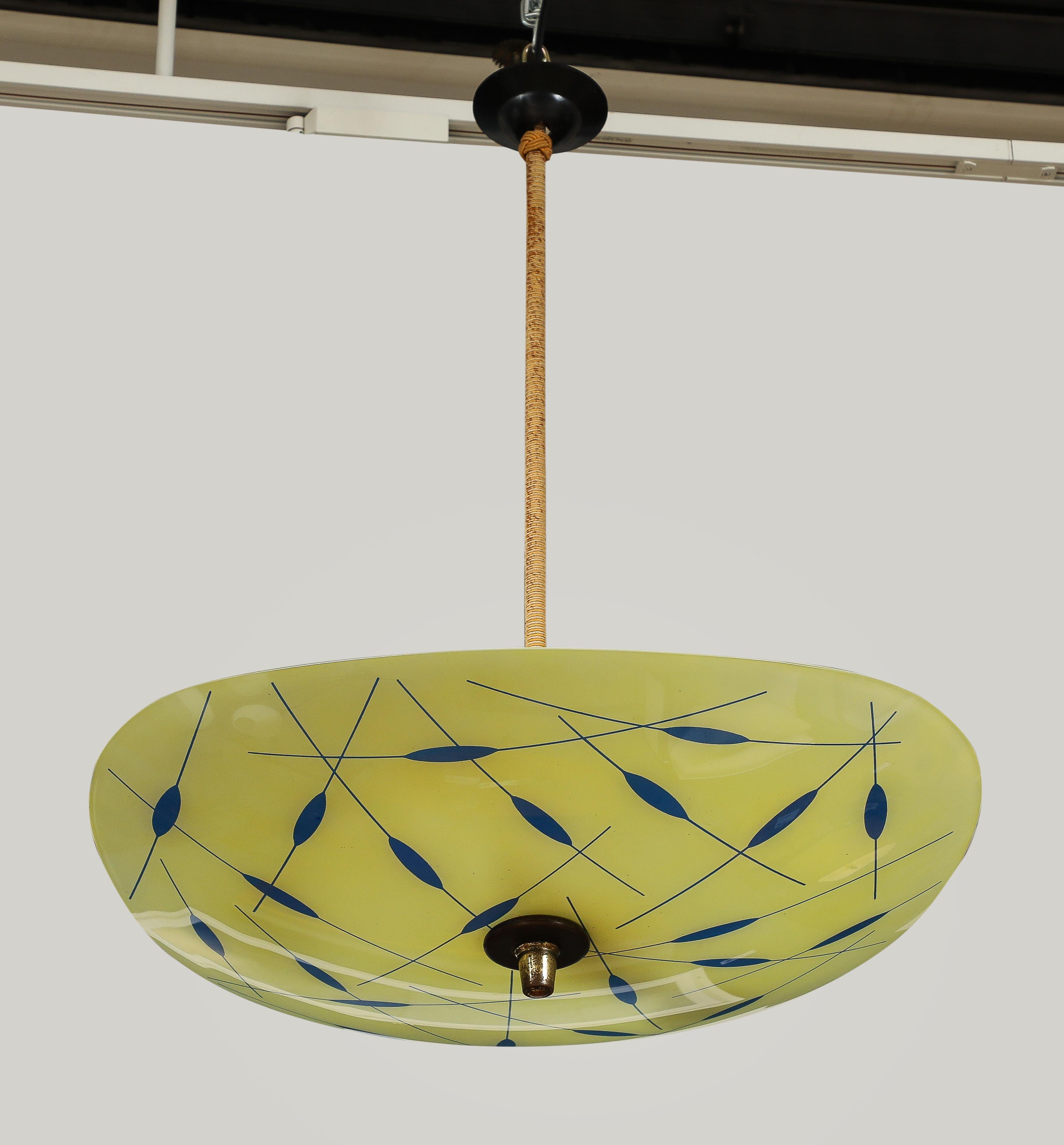 A Swedish off white asymmetrical glass pendant with blue decoration, Circa 1960-70, supported by a cloth wrapped steam. Rewired for US 2 x 60 watt max
