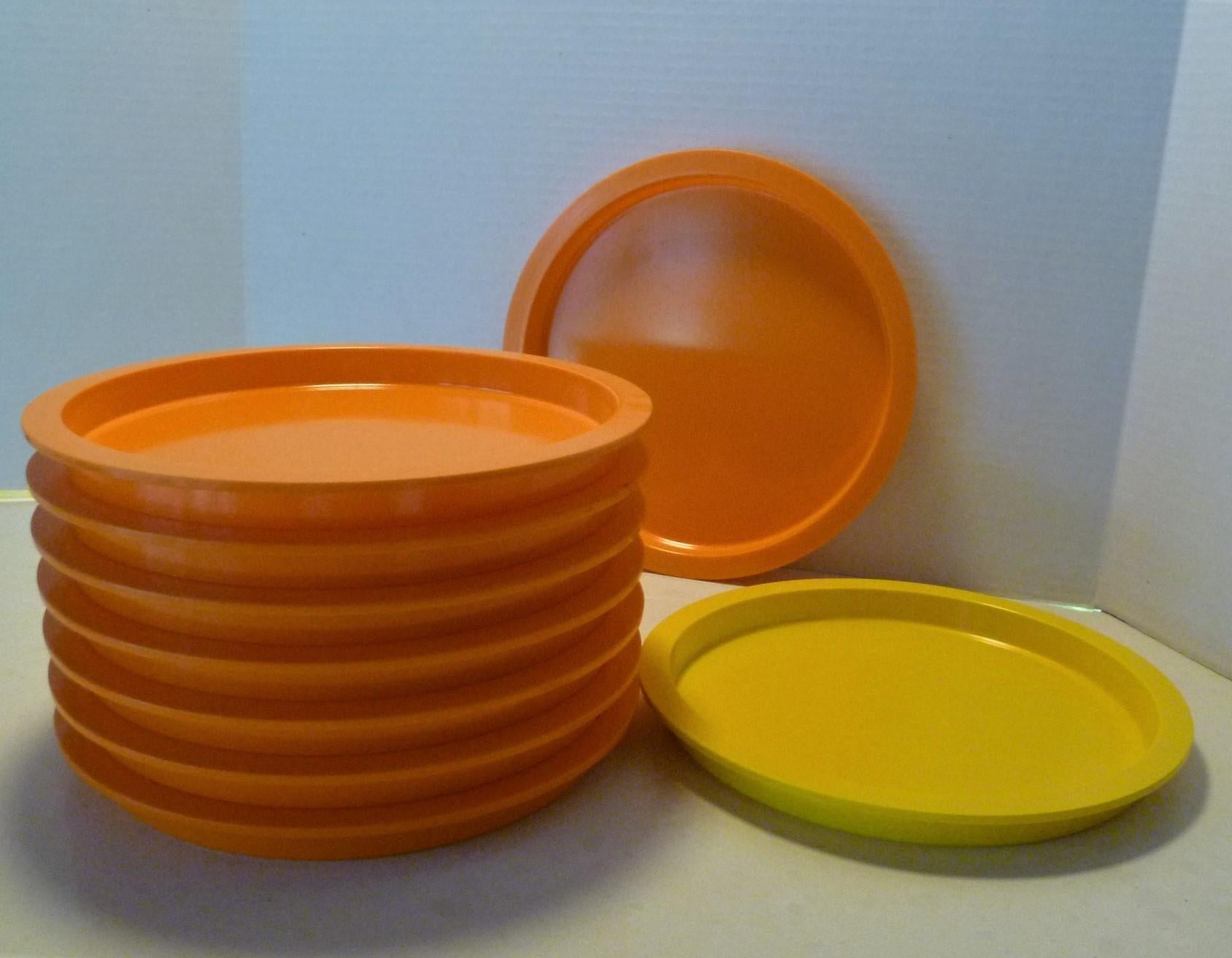 Swedish modern stackable melamine dishes in orange and yellow by Gunnar Cyren (1931-2013) for Dansk Designs 1970s. Set of 33 pcs. includes 9 dinner dishes (1 yellow), 16 lunch/salad/dessert dishes and 8 Bowls. Lovely Cantaloupe orange and canary