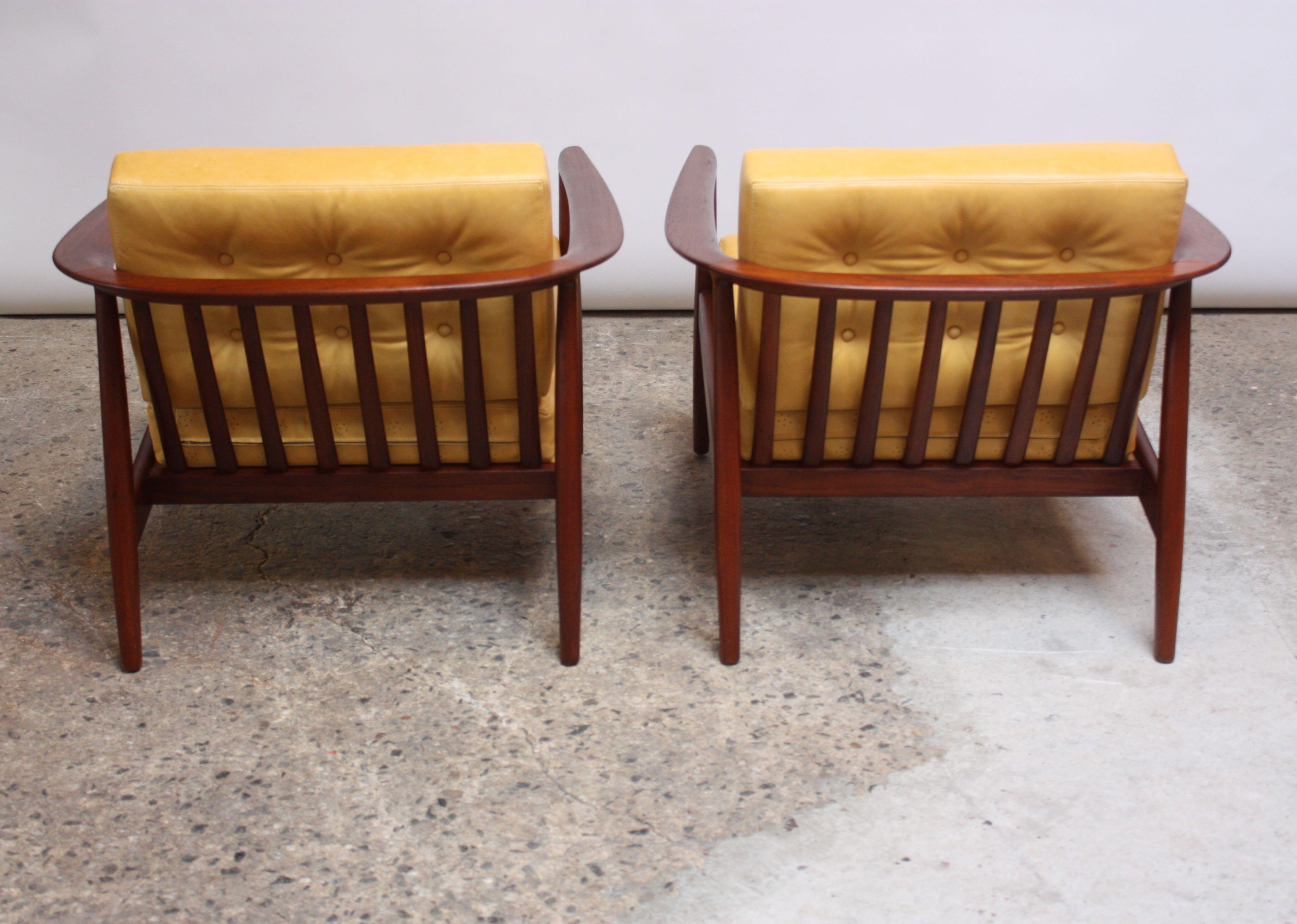 Swedish Modern Leather and Teak Lounge Chairs by Folke Ohlsson for DUX In Excellent Condition For Sale In Brooklyn, NY