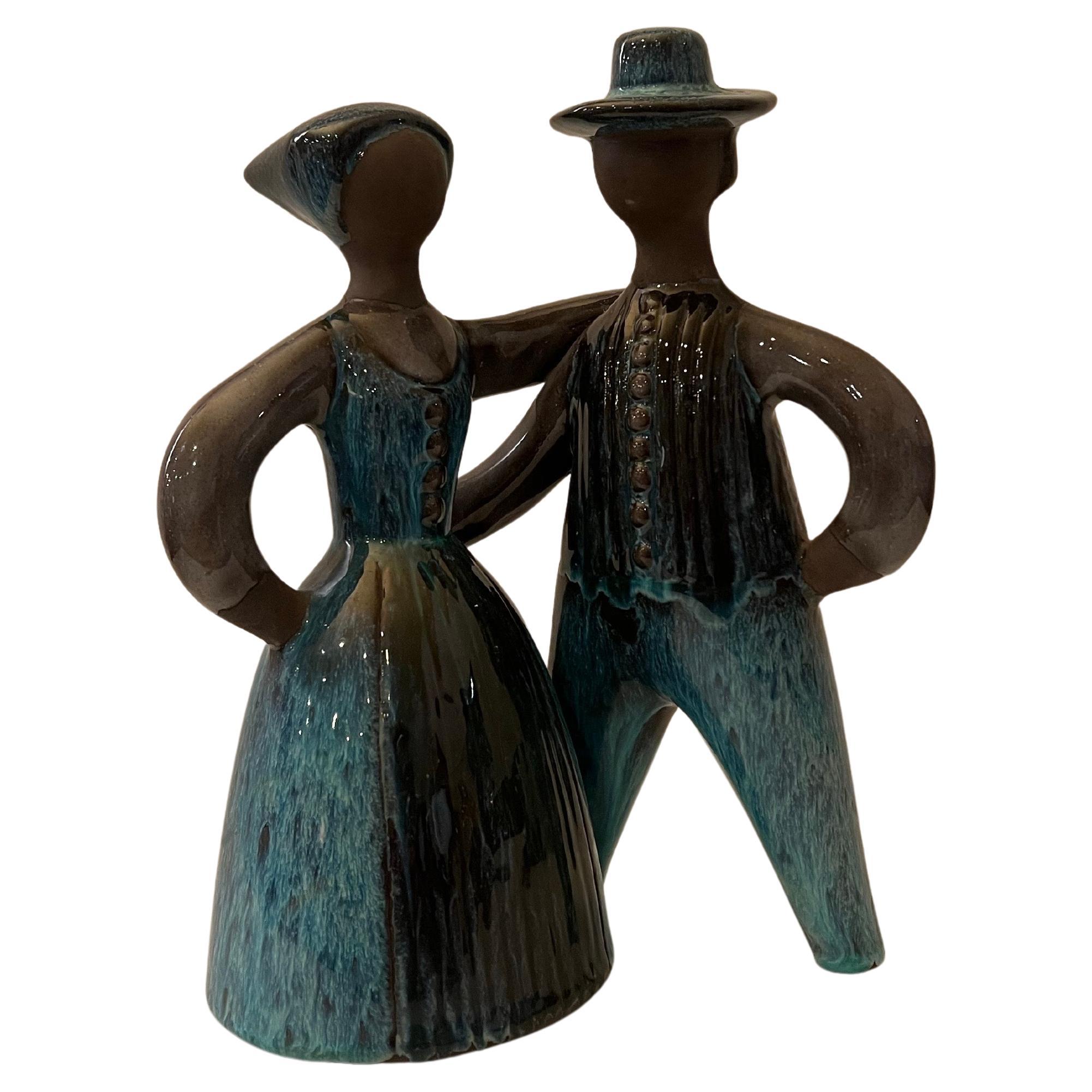 Beautiful figurative sculpture by artist Elsi Bourelious circa 1970's excellent condition no chips or cracks retains original label.