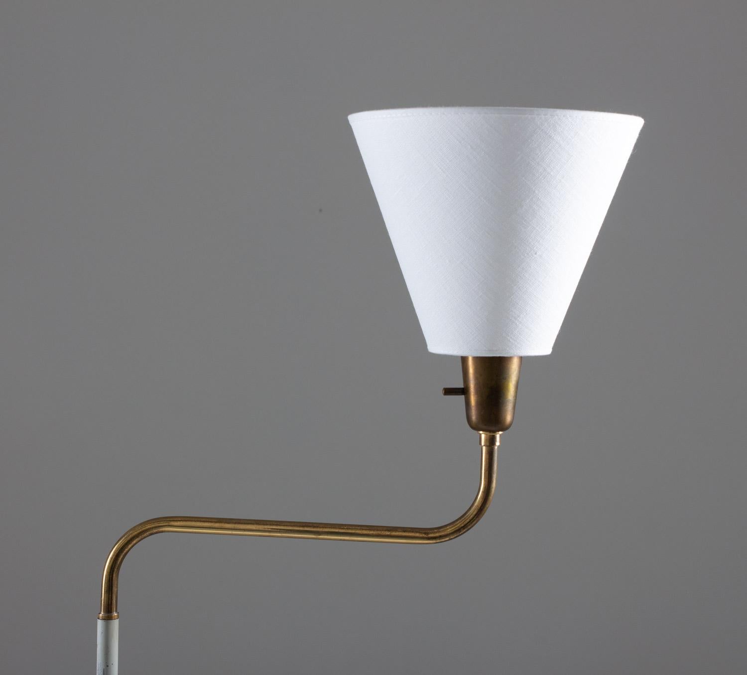 This beautiful floor lamp, manufactured by ASEA in the 1950s, is a true work of art. The uplight design and swivel-arm feature make it a versatile choice for illuminating any room. The combination of metal and brass gives the lamp a sleek and