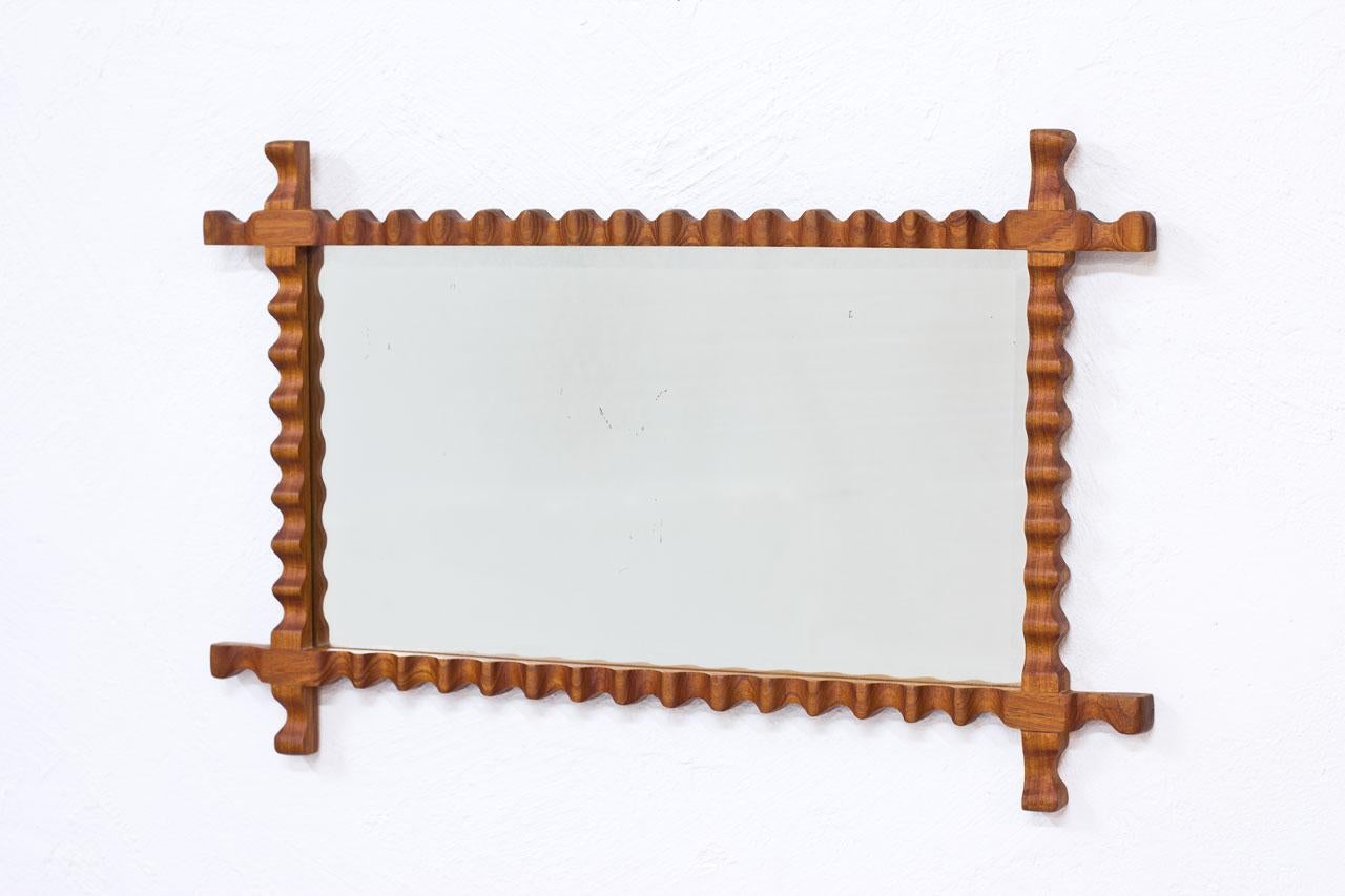 Wall mirror manufactured
in Sweden during the 1940s.
Elmwood frame.