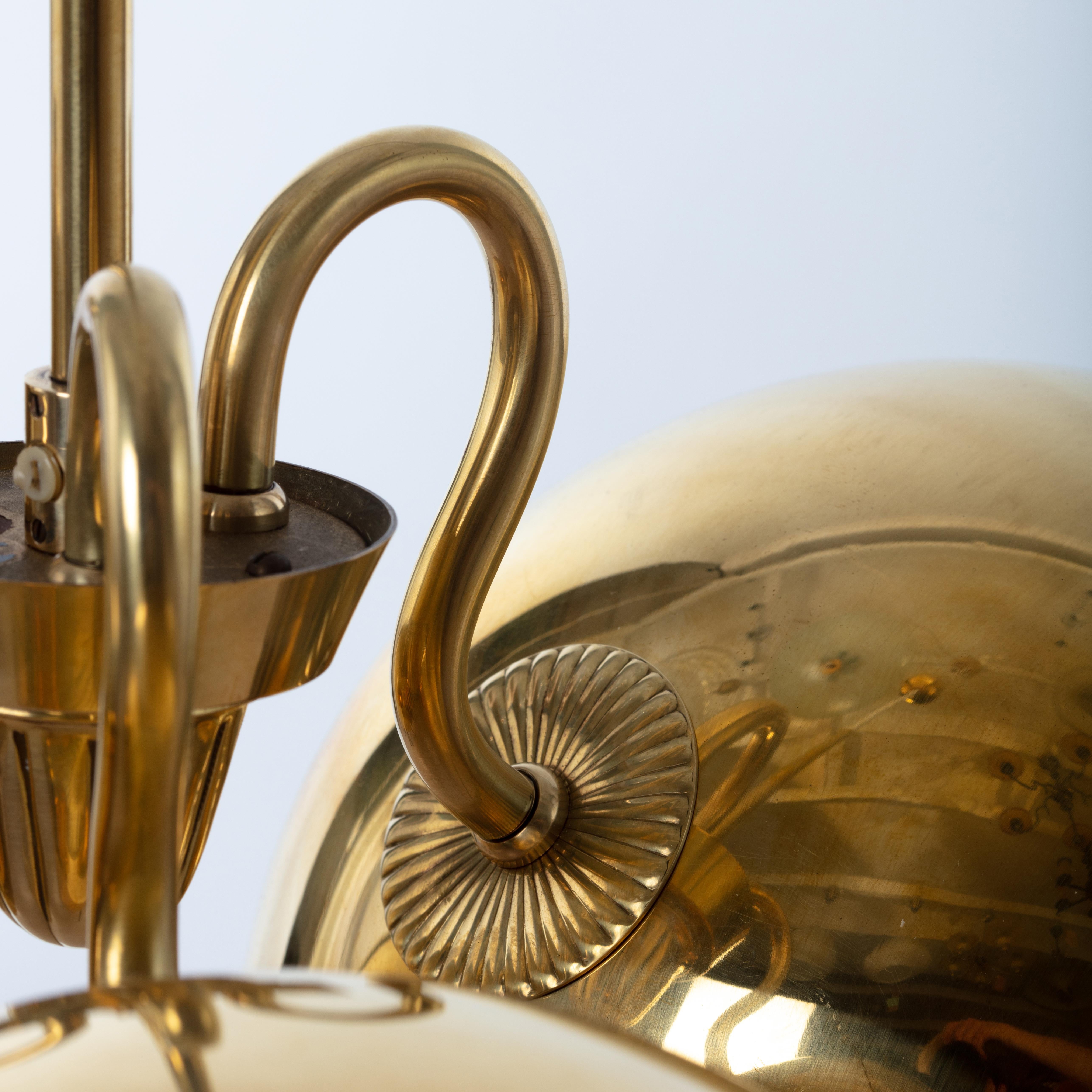 Swedish modern brass pendant with perforated brass shades 1940s by Carl-Axel Acking for Bröderna Malmströms Metallvarufabrik
Very good condition with few signs of wear and use.
Dimensions: Diameter 60cm/23.6 and adjustable height.
  