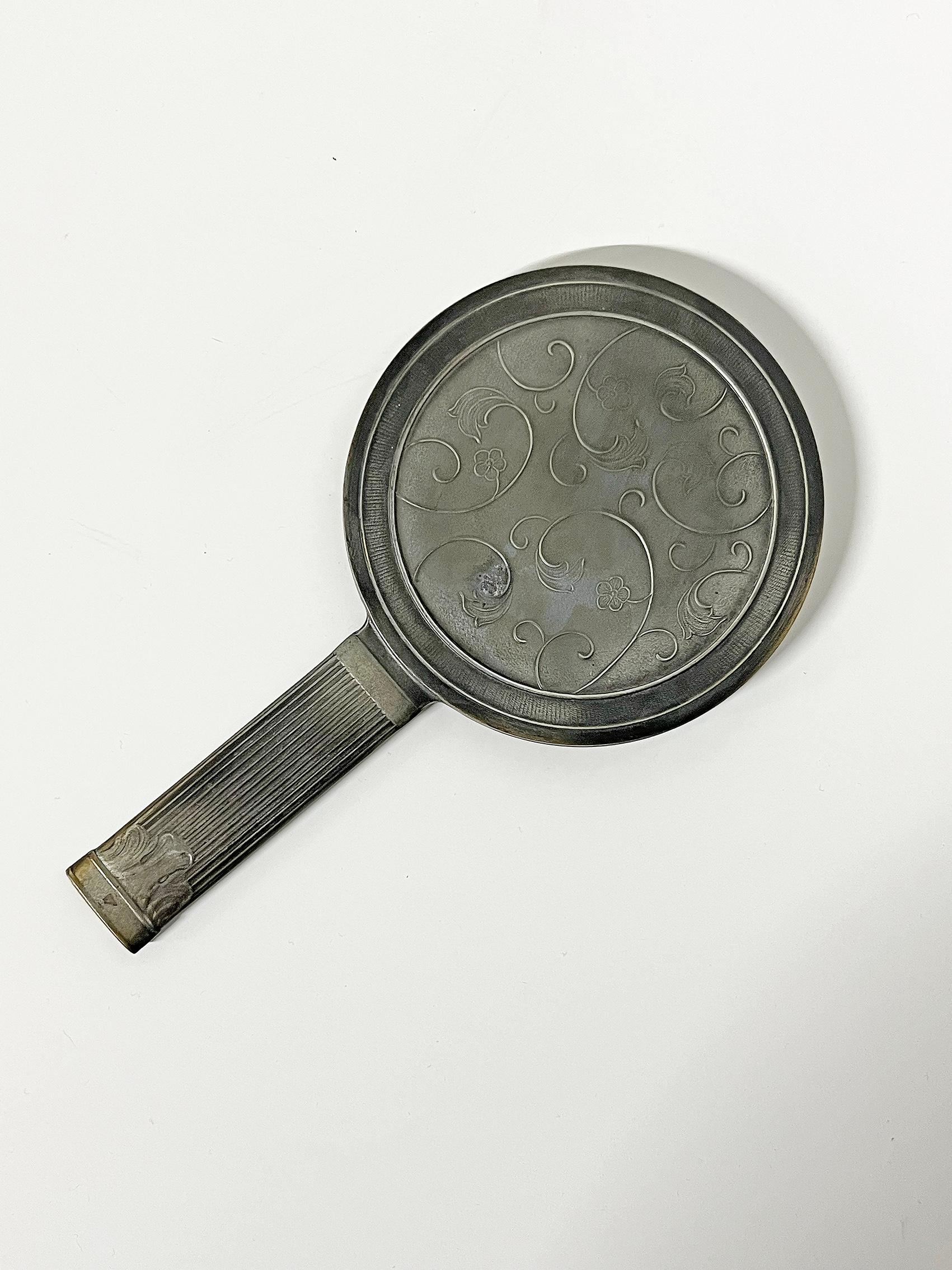 Beautiful, scandinavian modern pewter mirror, Sweden ca 1940's.  Unknown designer and maker. 
Signed on the handle: Made in Sweden. 
Wear and patina, consistent with age and use. Marks, scratches and blemishes. Metal and brass patina.