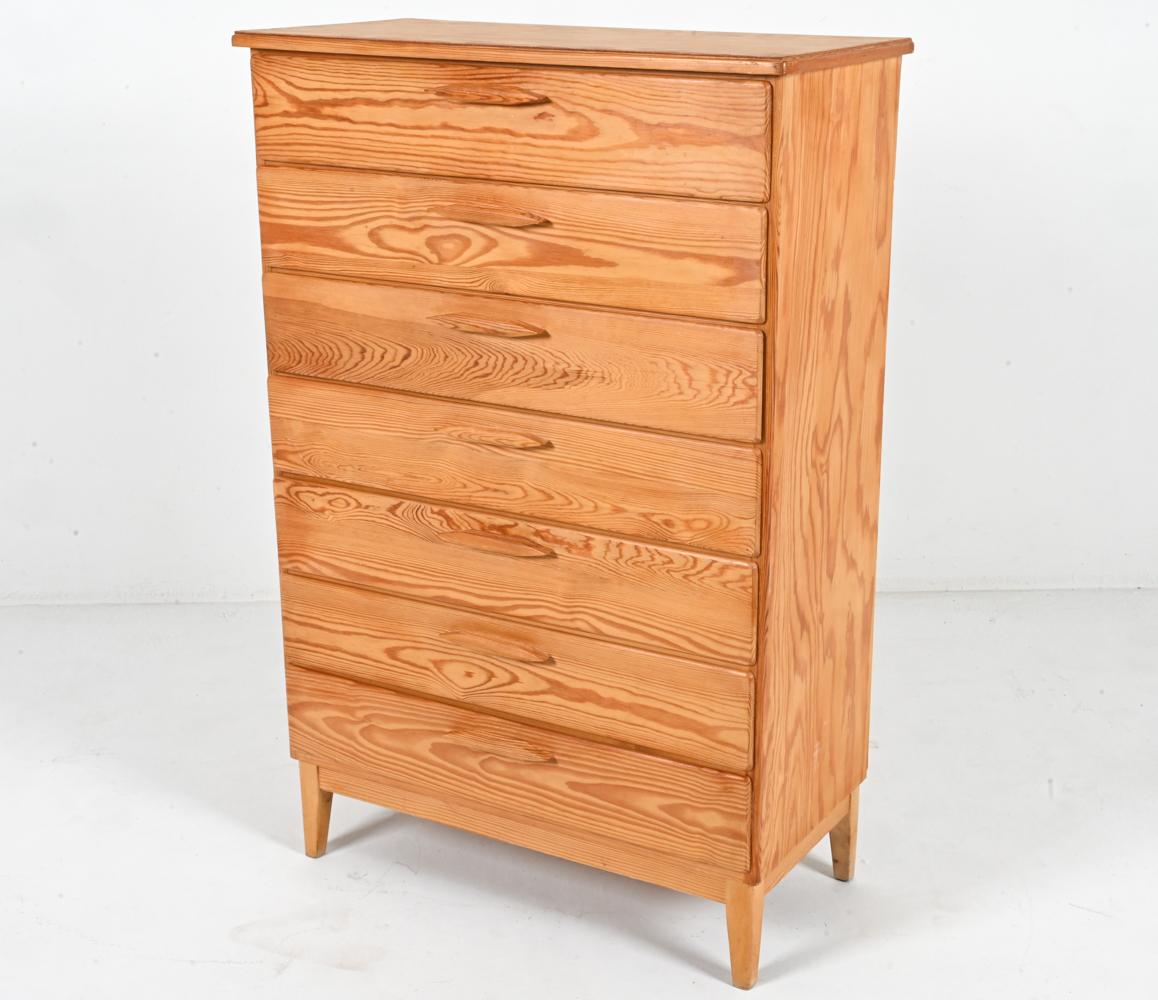 Embrace simplicity with this timeless and minimalist vintage tall chest of drawers. This functional gem was crafted in Sweden in the 1960's, embodying the enduring legacy of Scandinavian design. 

Showcasing the beauty of natural materials, the