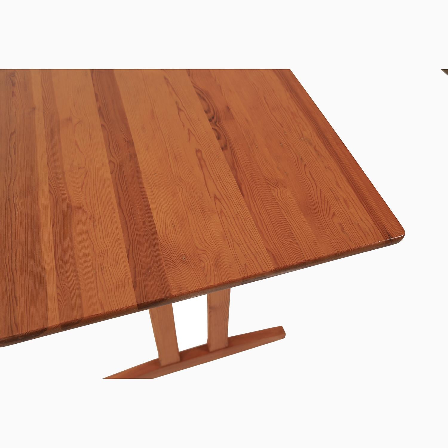 A minimal Swedish designed and made pine trestle table. A smaller scale table perfect for a smaller seating area or use as a writing desk. Solid wood top with shaker style trestle base. 

Professional, skilled furniture restoration is an integral
