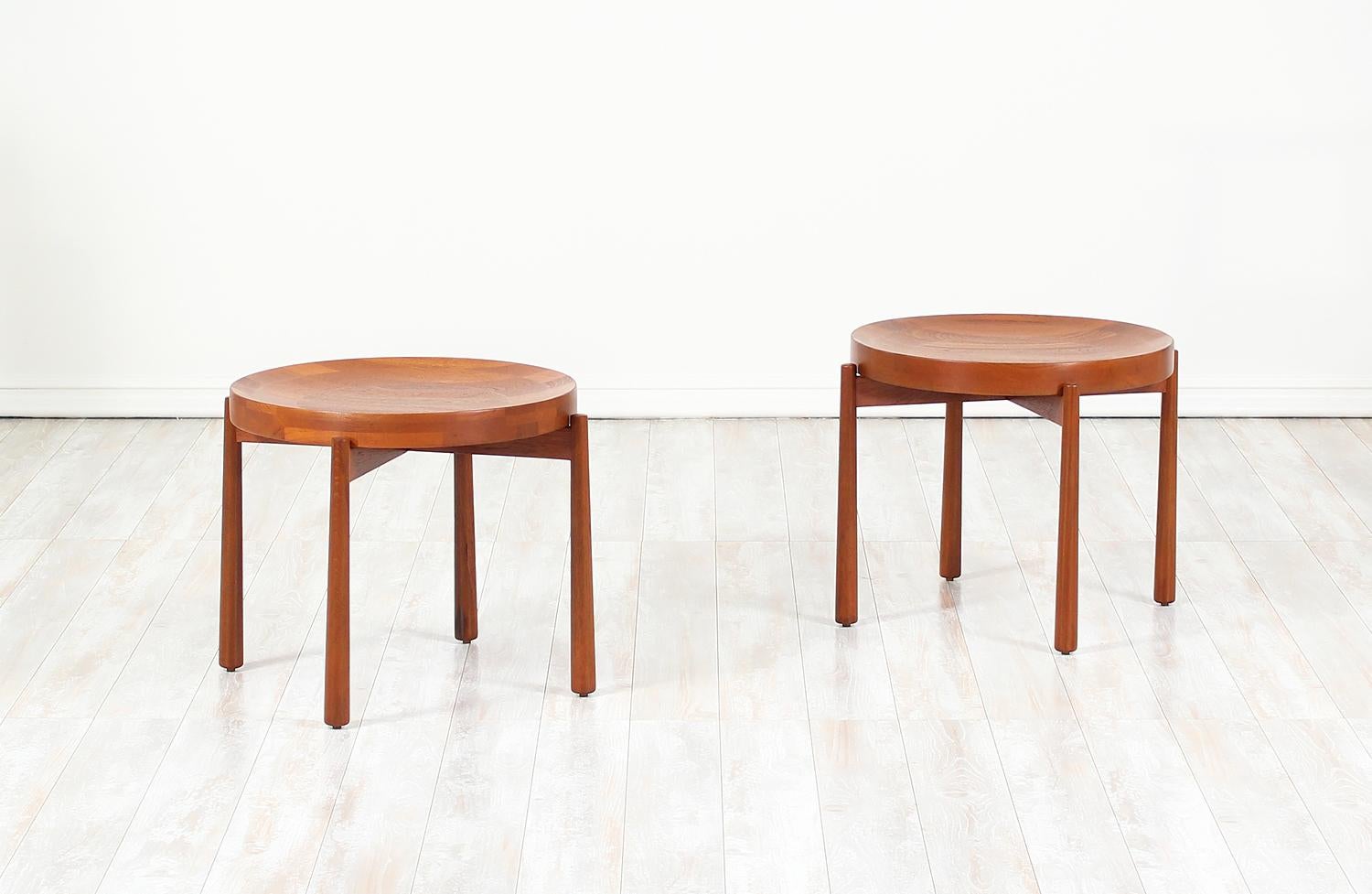 Pair of reversible tray top side tables designed and manufactured by Dux of Sweden circa 1960’s. This extraordinary design is comprised of teak wood with four sturdy tapered legs that support the removable/reversible tabletop tray. Originally