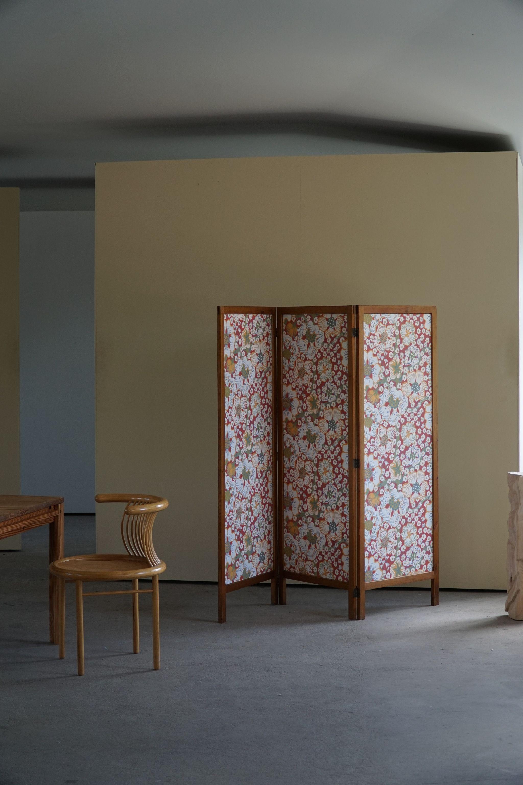 A marvellous room divider made in pine, later upholstered with fabric from Svenskt Tenn. Made by a Swedish Cabinetmaker in the 1960s. Exclusively decorated with a beautiful flower motif 