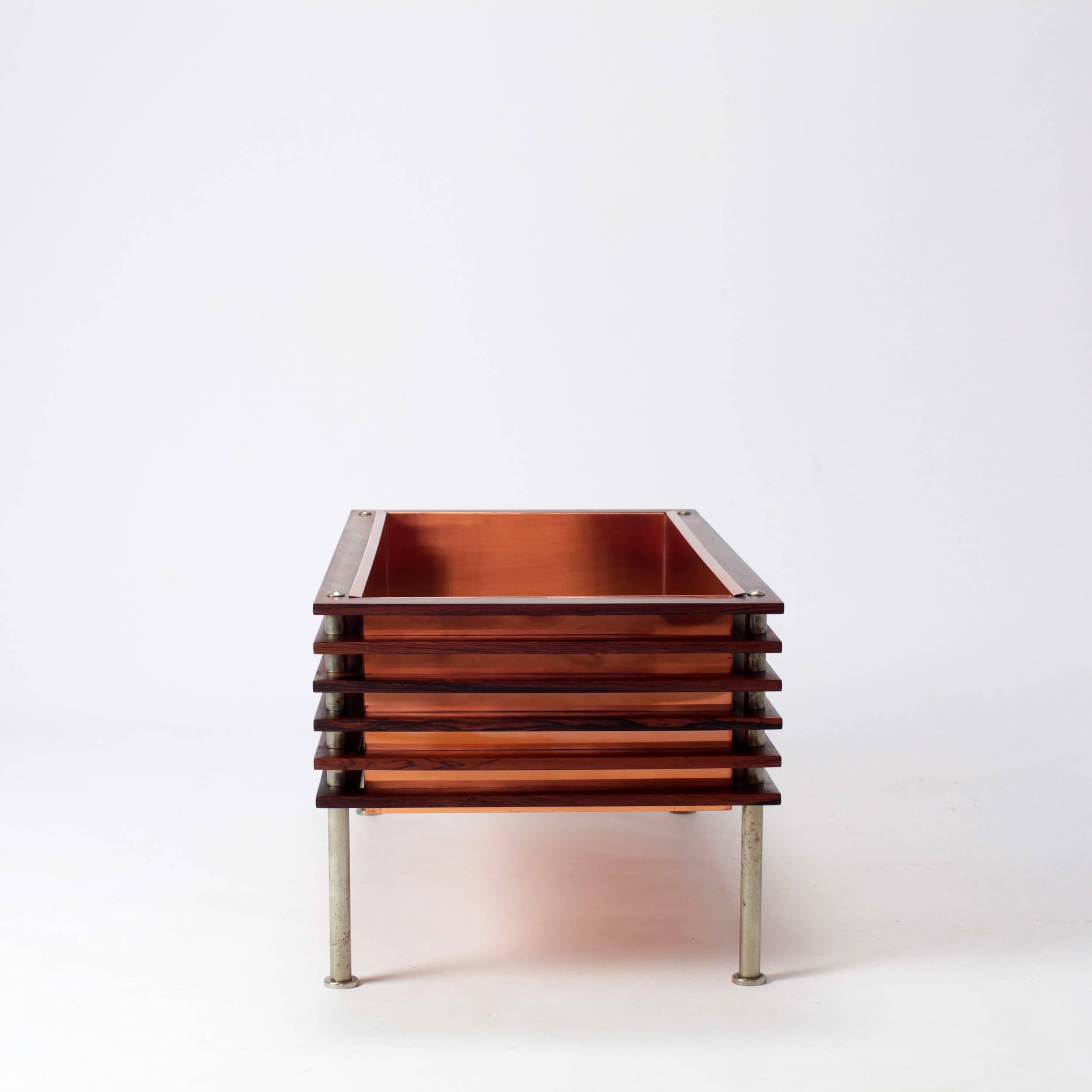 Rare and beautiful planter from Sweden attributed to Nils Jonsson and manufactured by Troeds in the 1960s.
In rosewood, copper and steel nickeled.
 